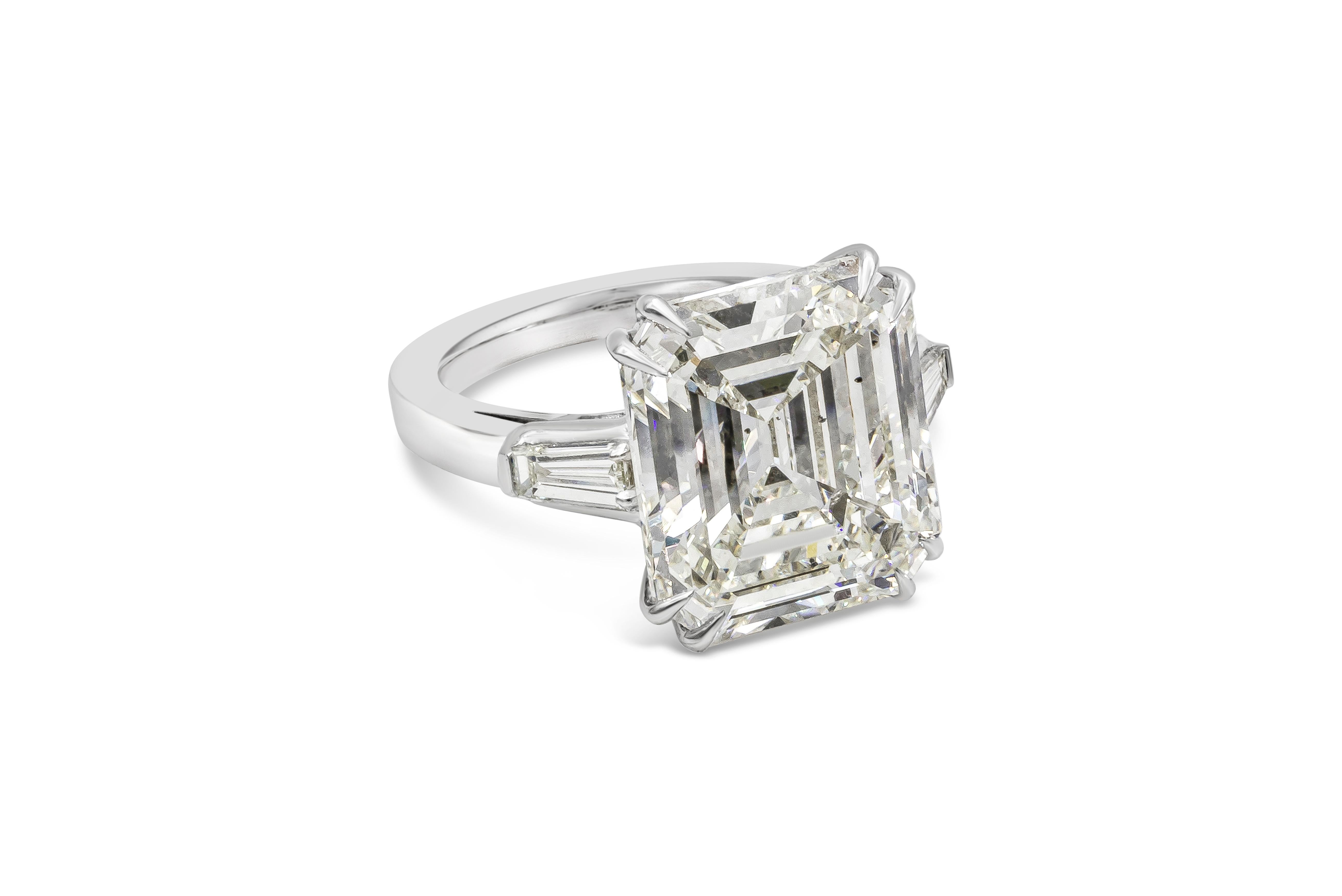 An amazing and classic engagement ring showcasing a GIA Certified 12.55 carats emerald cut diamond, K Color and SI2 in Clarity. Flanked by tapered baguette diamonds on each side weighing 0.50 carat total. Made with Platinum. Size 6.5 US and