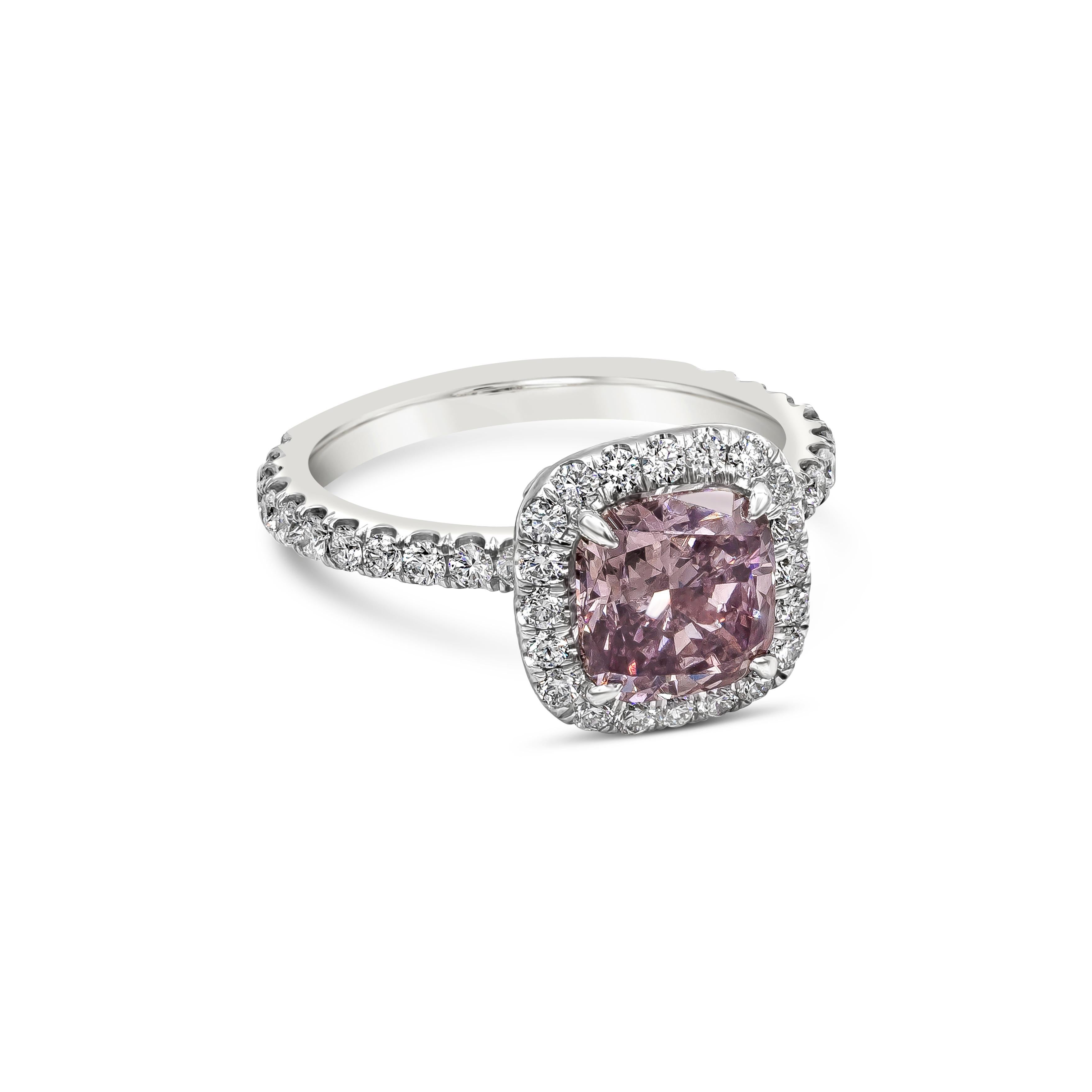 A rare color engagement ring showcasing a GIA Certified 2.16 carats cushion cut Fancy Dark Brown-Pink Color Diamond and SI2 in clarity. Surrounding the center stone is a row of halo round brilliant diamonds, and goes half way down the shank,