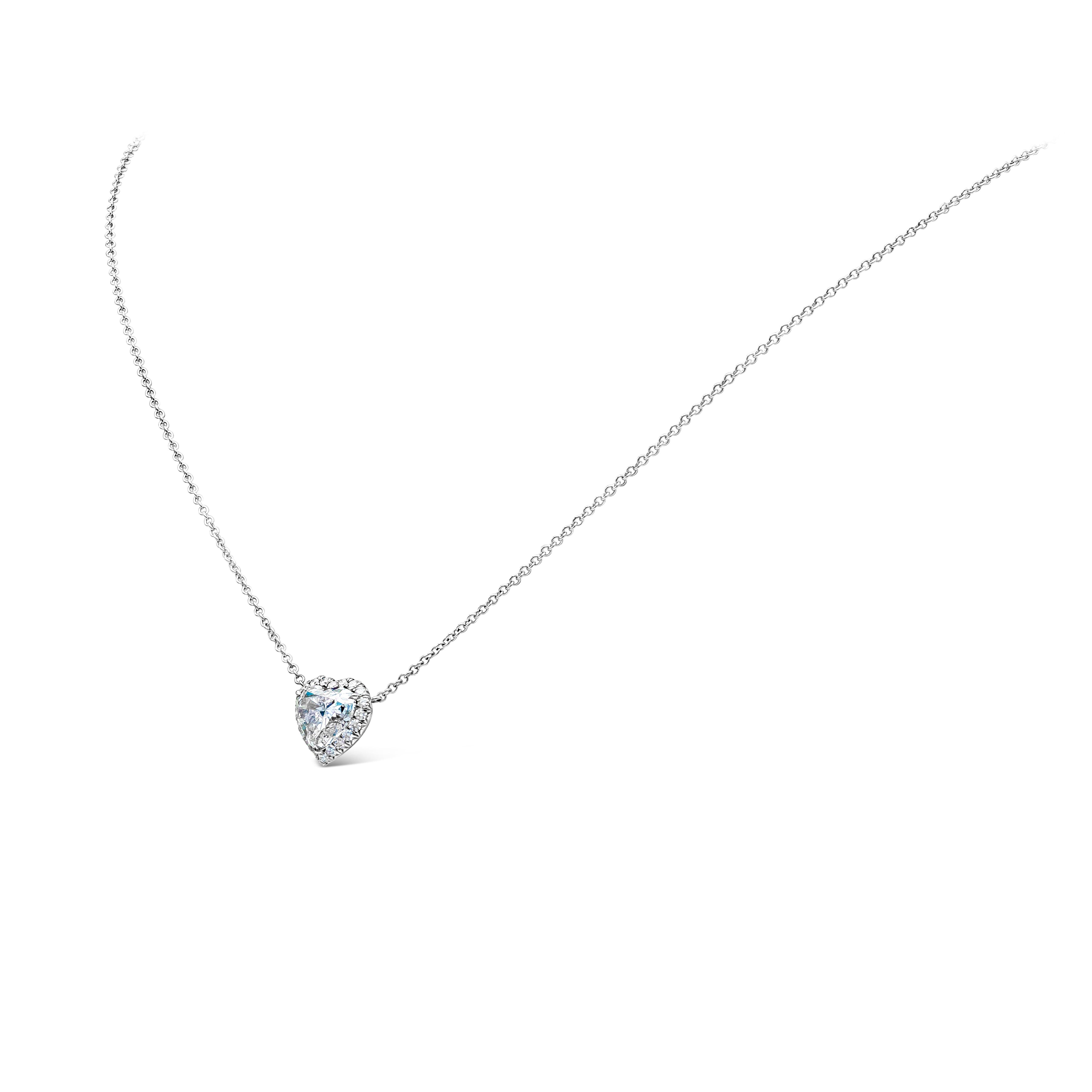 A simply elegant piece showcasing a GIA Certified 1.80 carat heart shape pendant necklace, H Color and SI2 in Clarity. Surrounded by a row of round diamonds weighing 0.23 carats total, H Color and VS-SI in Clarity set in Platinum. Made with 18K