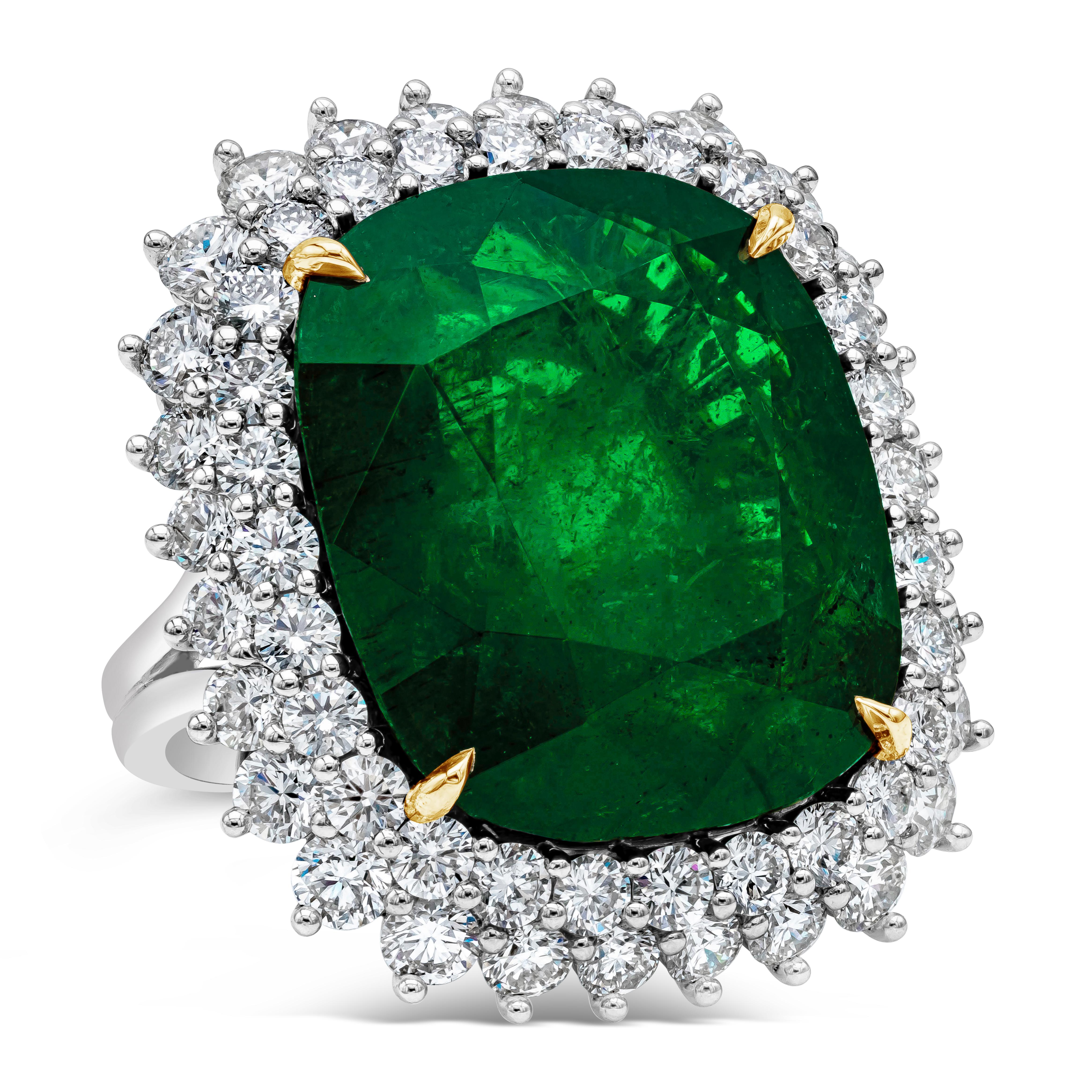 Elegant and well crafted high end cocktail ring showcasing a GIA certified 24.75 carat cushion cut green emerald gemstone surrounded by 56 round brilliant diamonds weighing 3.98 carats total,F-G color and VS clarity. Center gemstone is set in an 18k