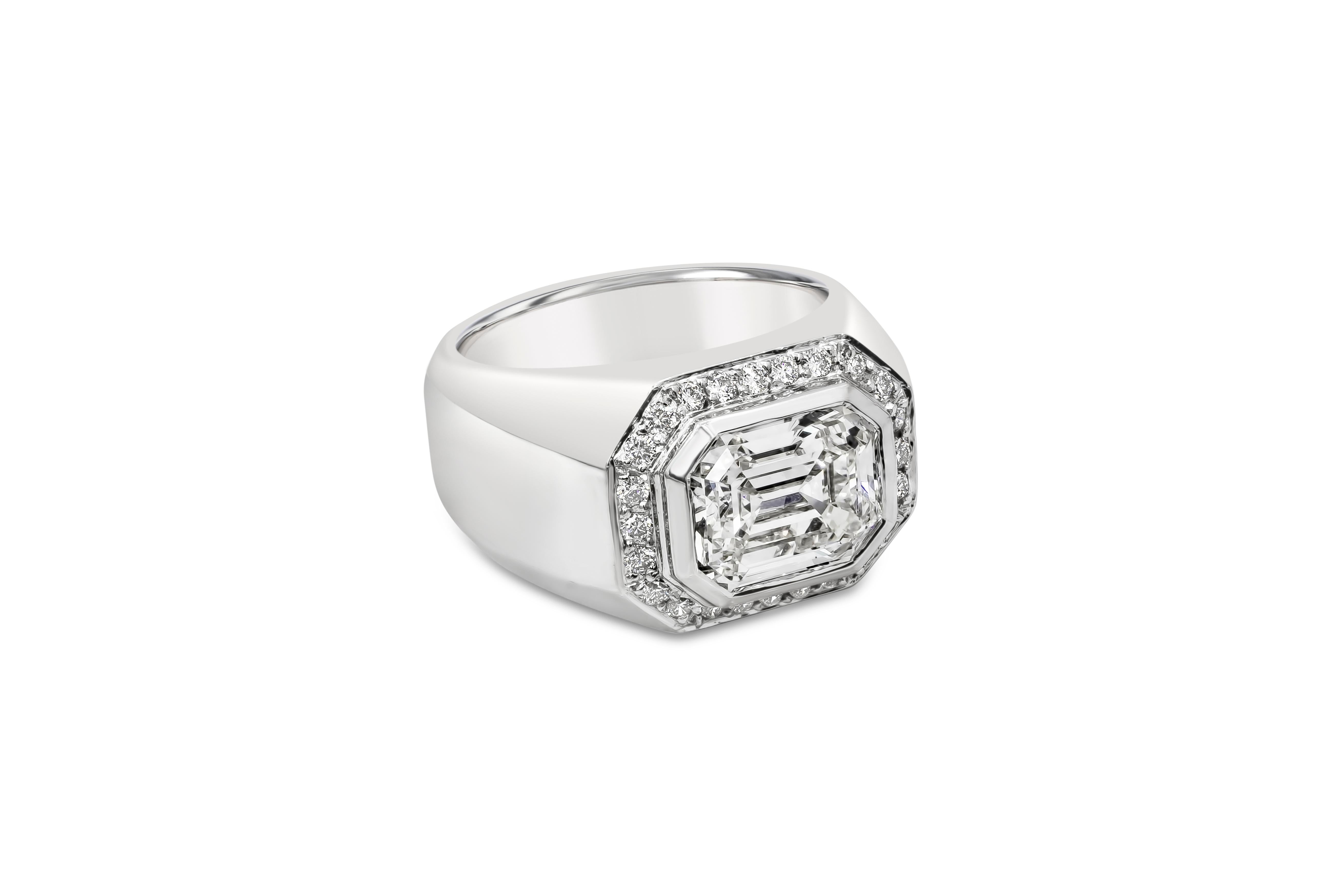 A marvelous mens ring features a dazzling bezel set GIA Certified 3.14 carat emerald cut diamond, H Color and IF in Clarity. Surrounded in an outer halo design by a row of round diamonds weighing 0.30 carats. Matte finish, Made in 14K White Gold,