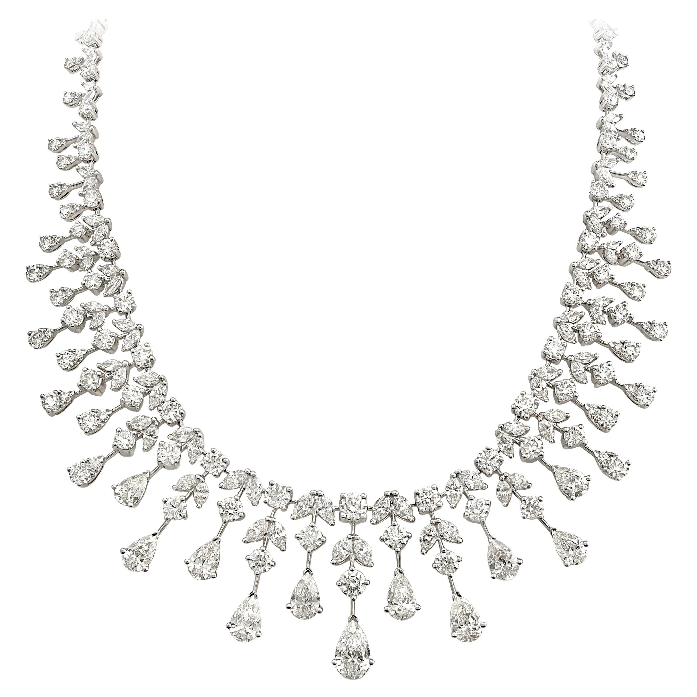 A luxurious and elegantly made diamond chandelier necklace, showcasing 276 brilliant pieces of mixed cut (round, pear, and marquise) diamonds weighing 37.20 carats total. Set on an 18K white gold graduating chandelier diamond drop design. Five pear