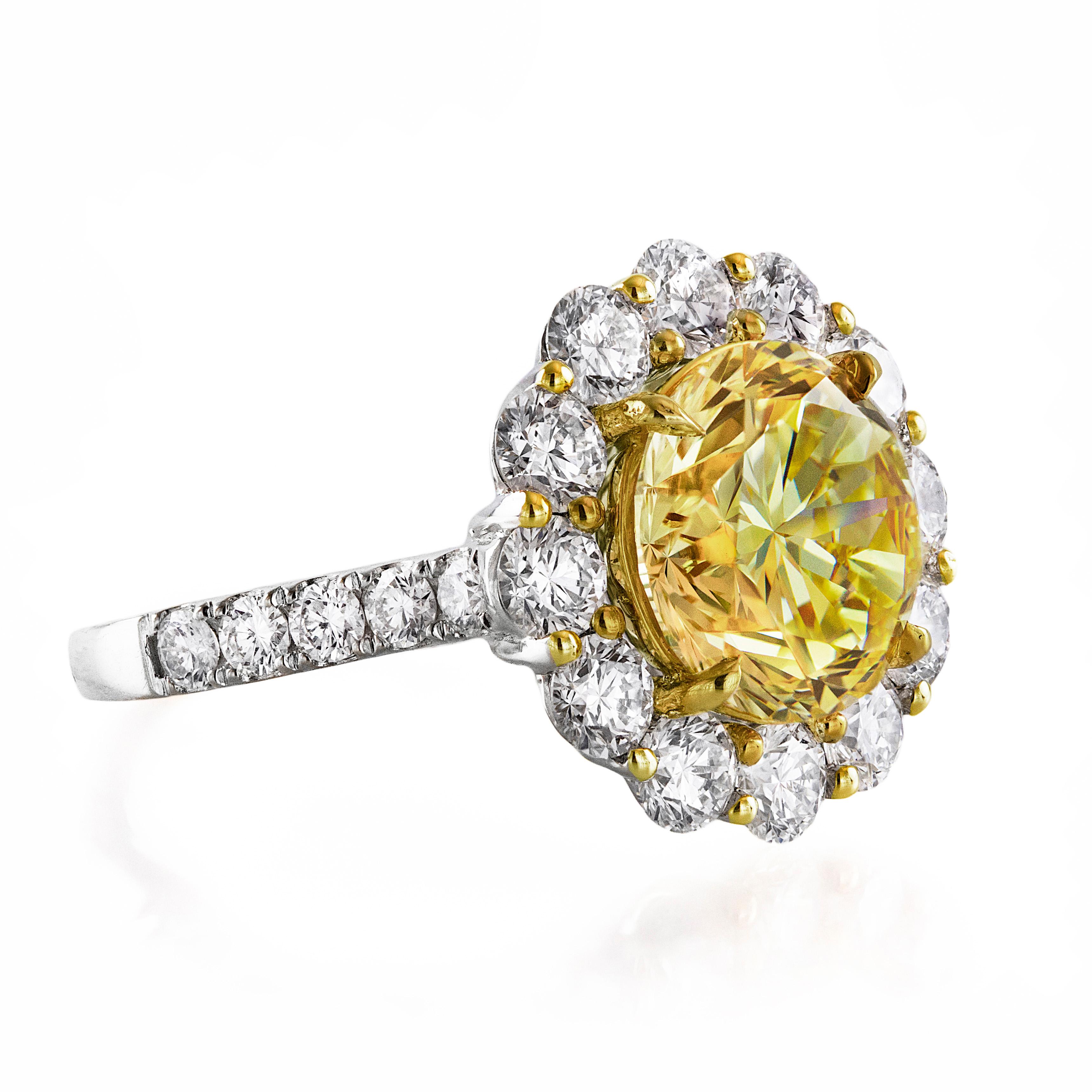 This magnificent and rare high end jewelry showcasing, 4.47 carat brilliant round cut diamonds certified by GIA as Fancy Intense Yellow color and VVS2 clarity. The color of this intense yellow diamond is very strong and in real life appears to be