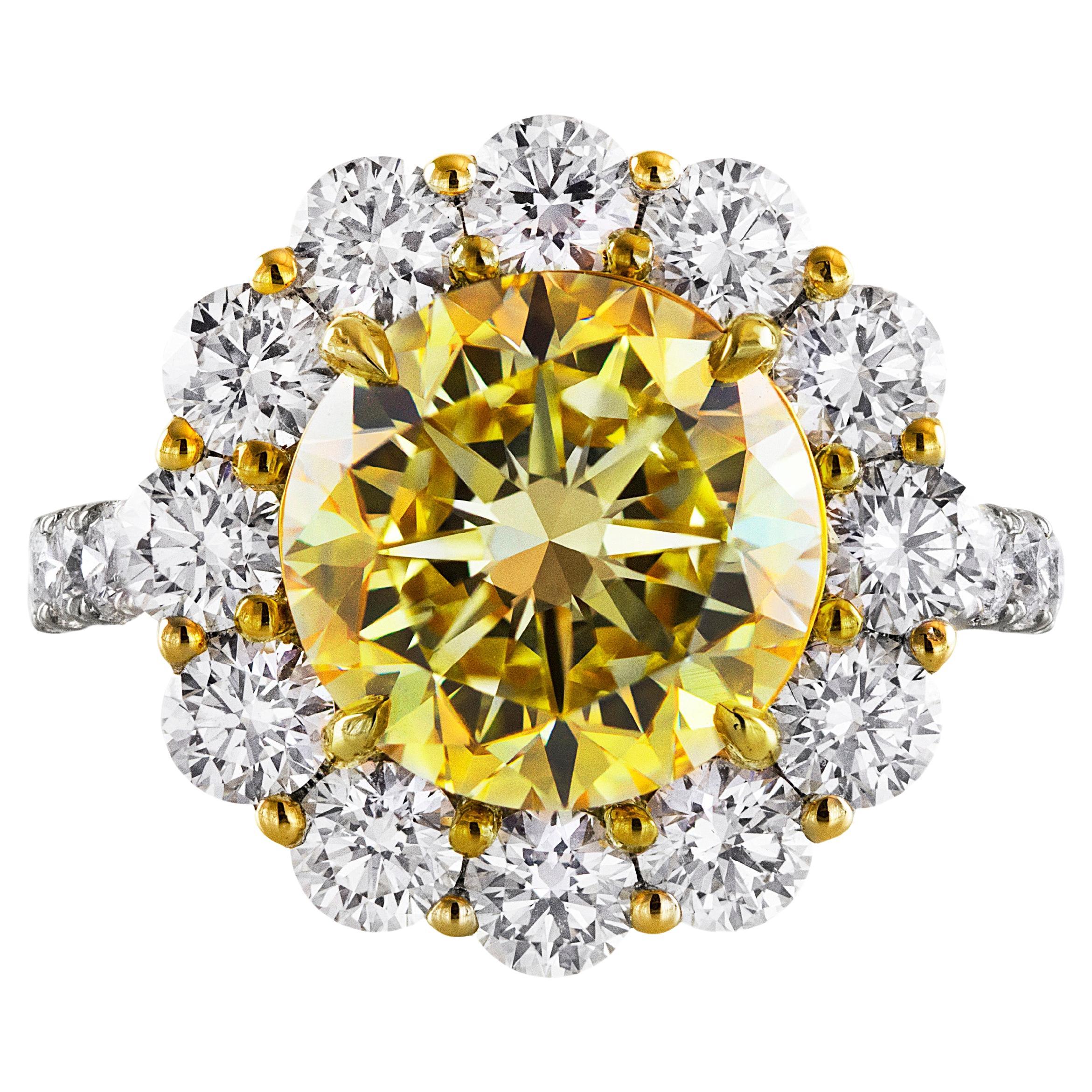 GIA Certified 4.47 Carat Round Cut Fancy Intense Yellow Diamond Engagement Ring For Sale