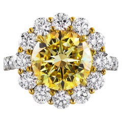 GIA Certified 4.47 Carat Round Cut Fancy Intense Yellow Diamond Engagement Ring