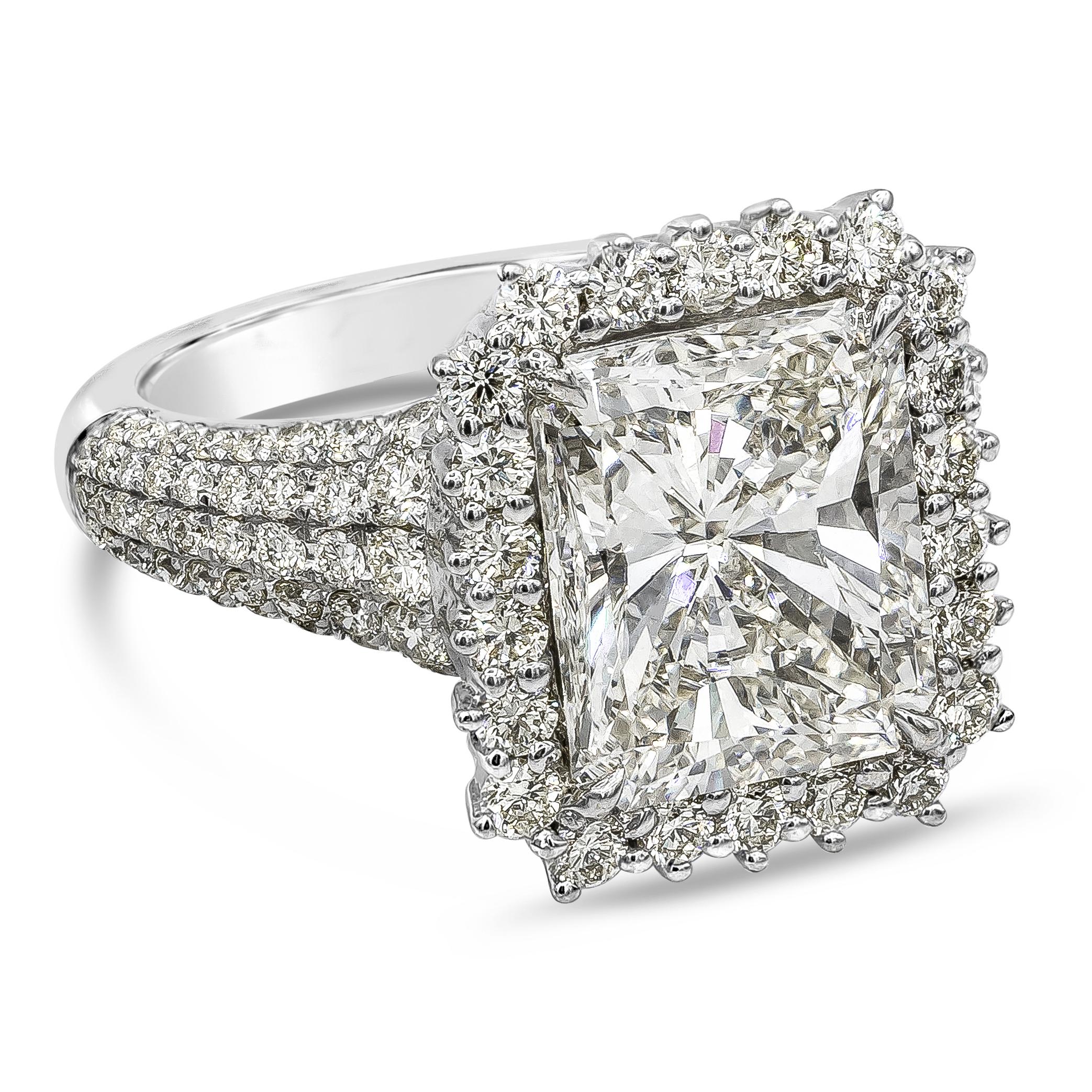 Elegantly made diamond engagement ring showcasing a 5.01 carats radiant cut diamond certified by GIA as L color, SI1 in clarity, surrounded by a single row of round brilliant diamonds. Set in a polished 18k white gold mounting, accented with round