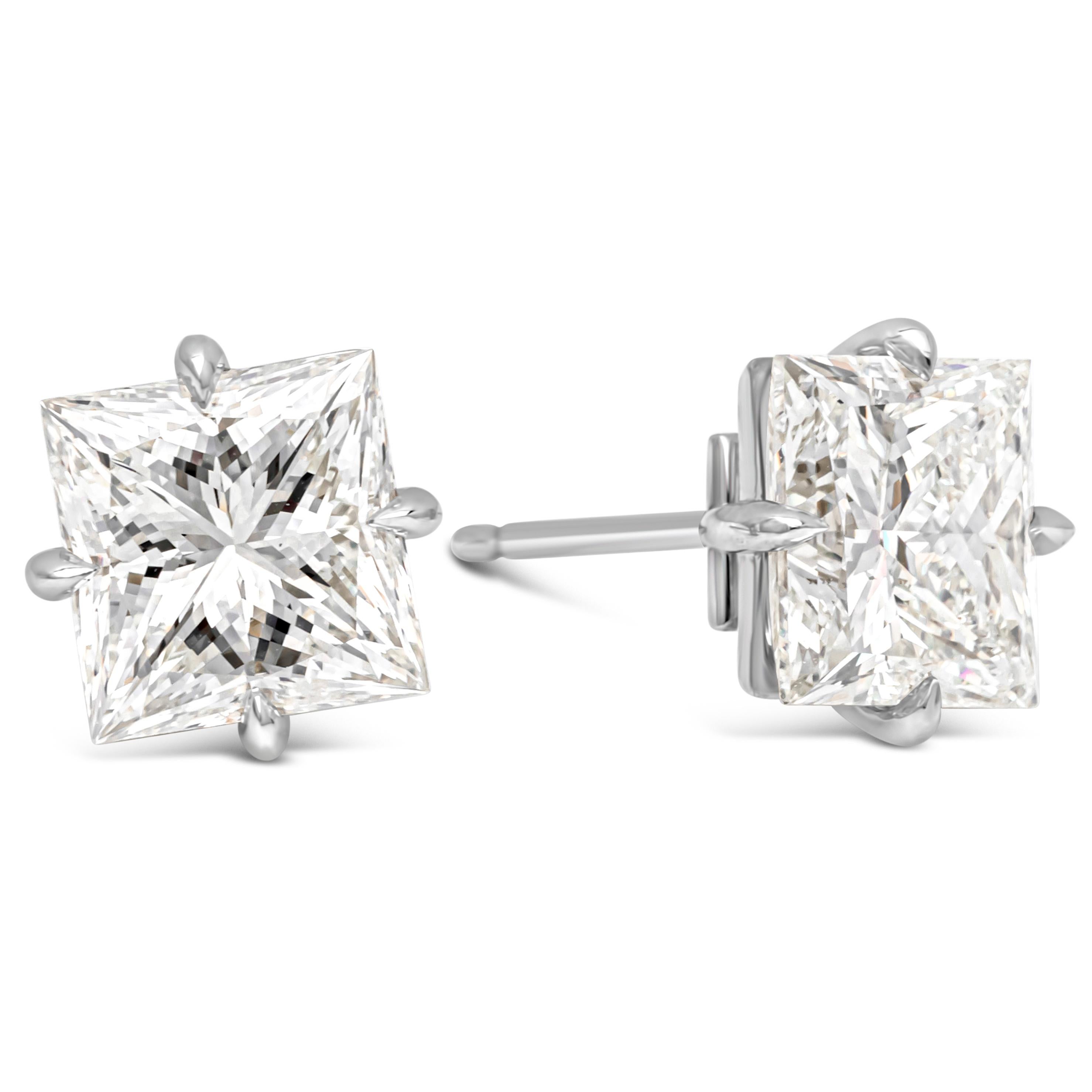 Elegantly made classic pair of stud earrings showcasing two luxurious princess cut brilliant diamonds, weighing 6.07 carats total certified by GIA as I color and SI1-VS1 in clarity. Set in a traditional four prong setting and finely made in