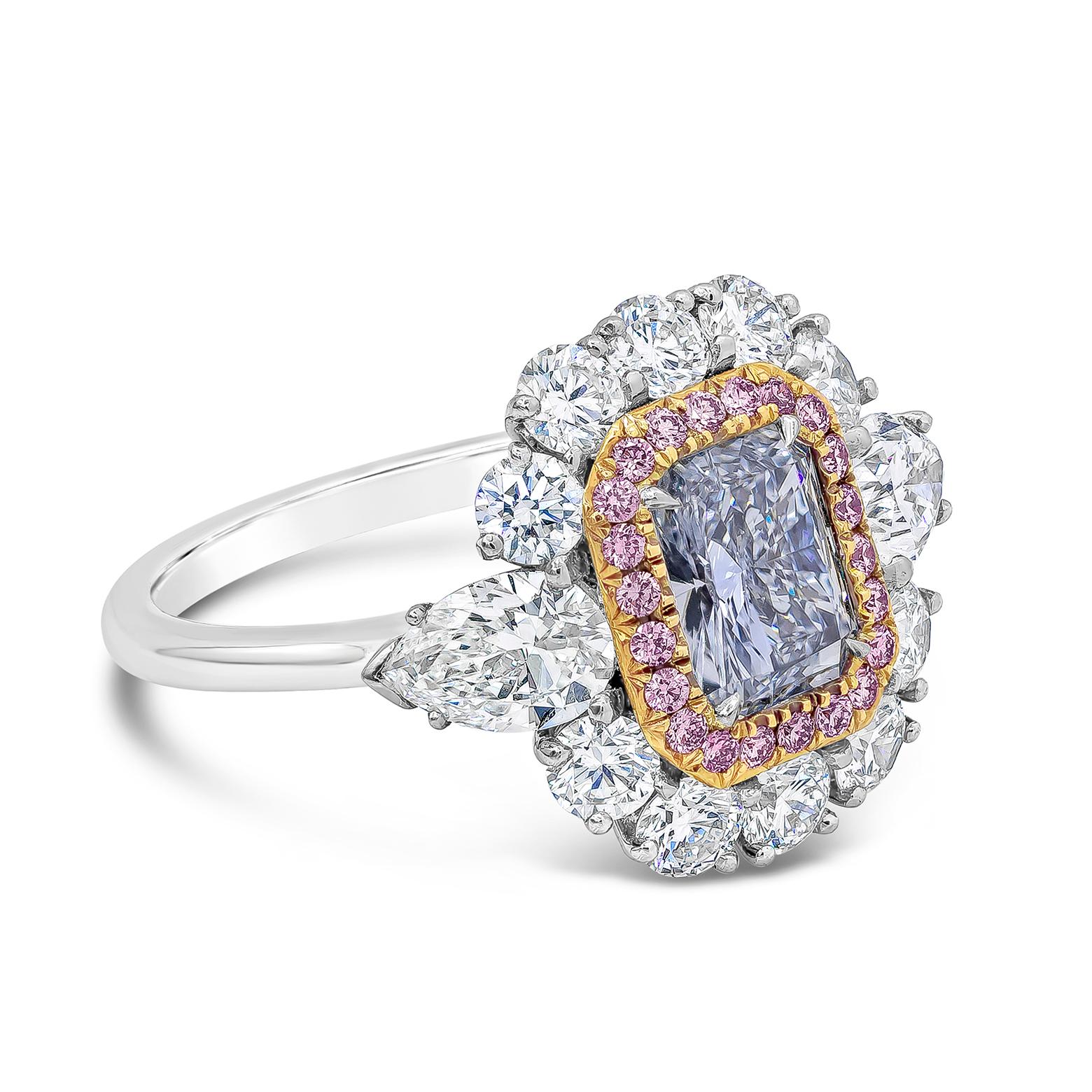 A rare and magnificent engagement ring, showcasing a vibrant 1.09 carats radiant cut diamond certified by GIA as Fancy Light Blue color and VS1 clarity, set on a four prong setting. Accented by a halo of 22 round cut pink diamonds weighing 0.21