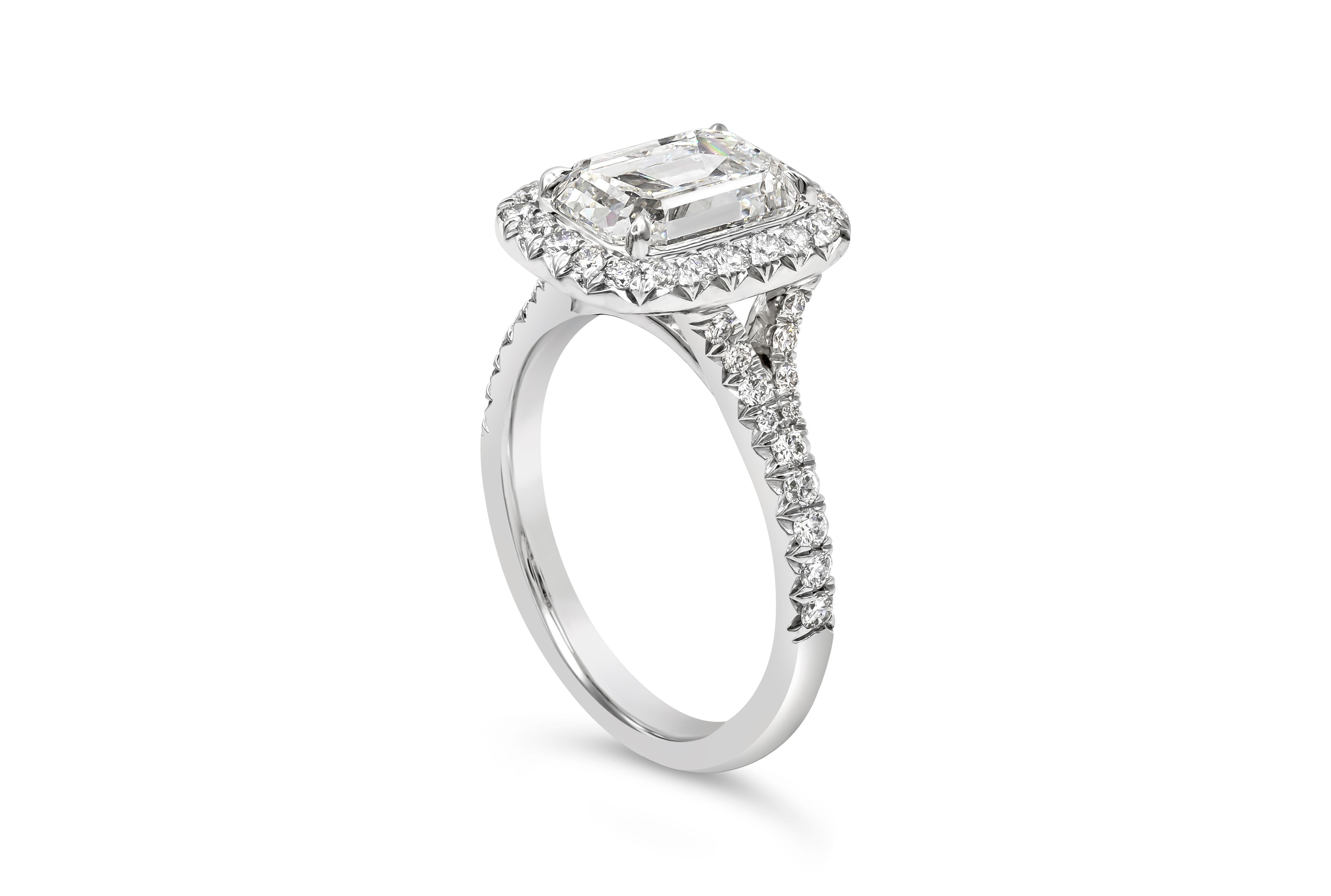An engagement ring that features a 2.51 carats emerald cut diamond certified by GIA as F color and SI1 clarity. Surrounded by a single row of round brilliant diamonds of 0.52 carat total and set in a platinum mounting. Size 6 US, resizable upon