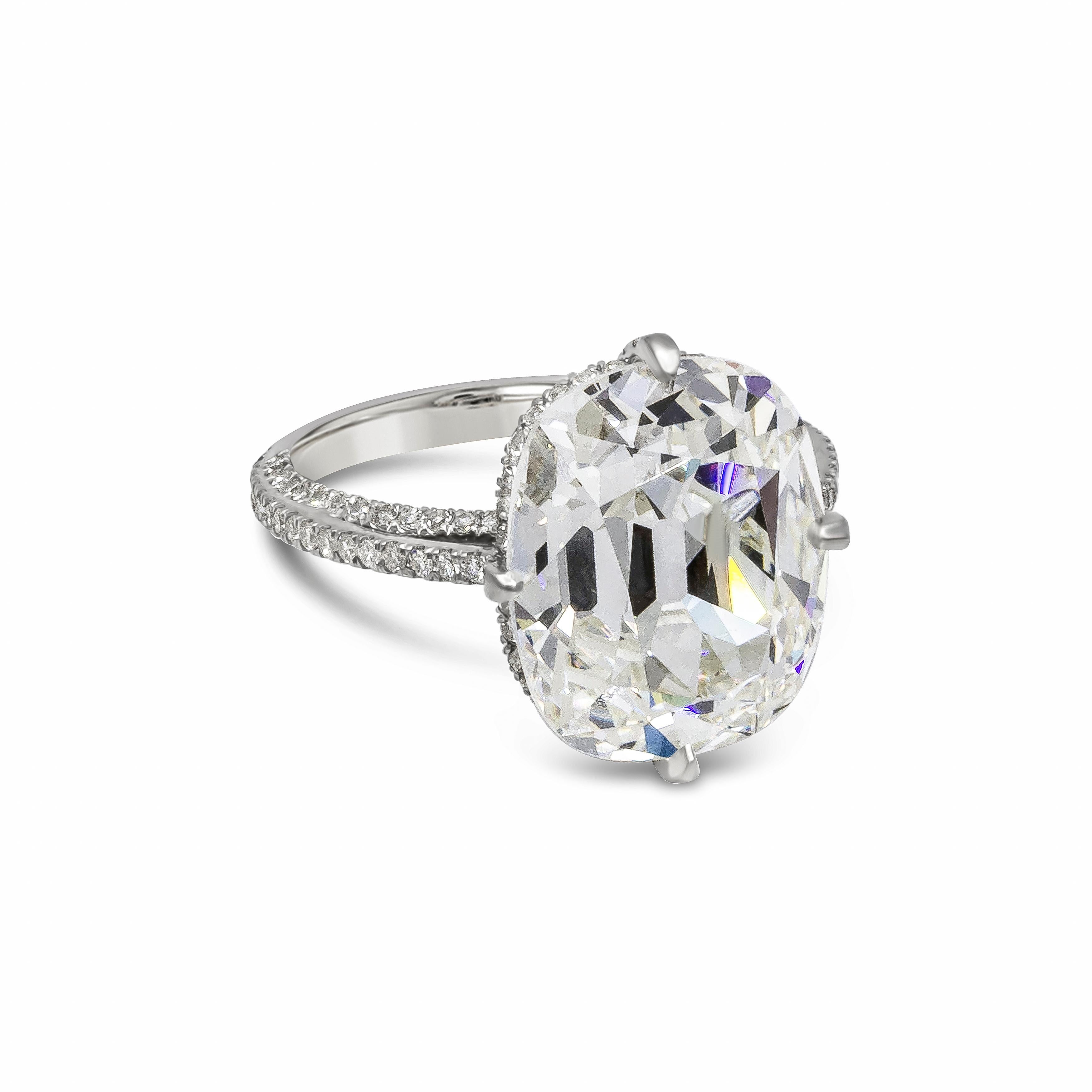 A spectacular and rare diamond cut weighing 8.94 carats. GIA certified the center diamond as an old mine cushion cut, J Color and VVS2 in Clarity. Set in a unique compass setting accented with pave diamonds on each side weighing 0.78 carat total.