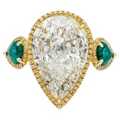 GIA Certified 6.65 Carat Pear Shape Diamond and Green Emerald Engagement Ring