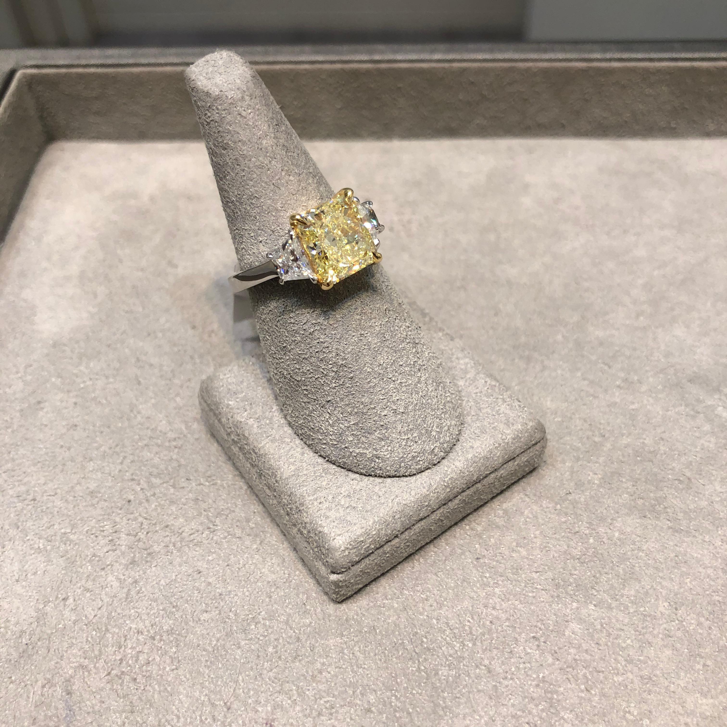 GIA Certified Radiant Cut Fancy Yellow Diamond Three-Stone Engagement Ring In New Condition For Sale In New York, NY