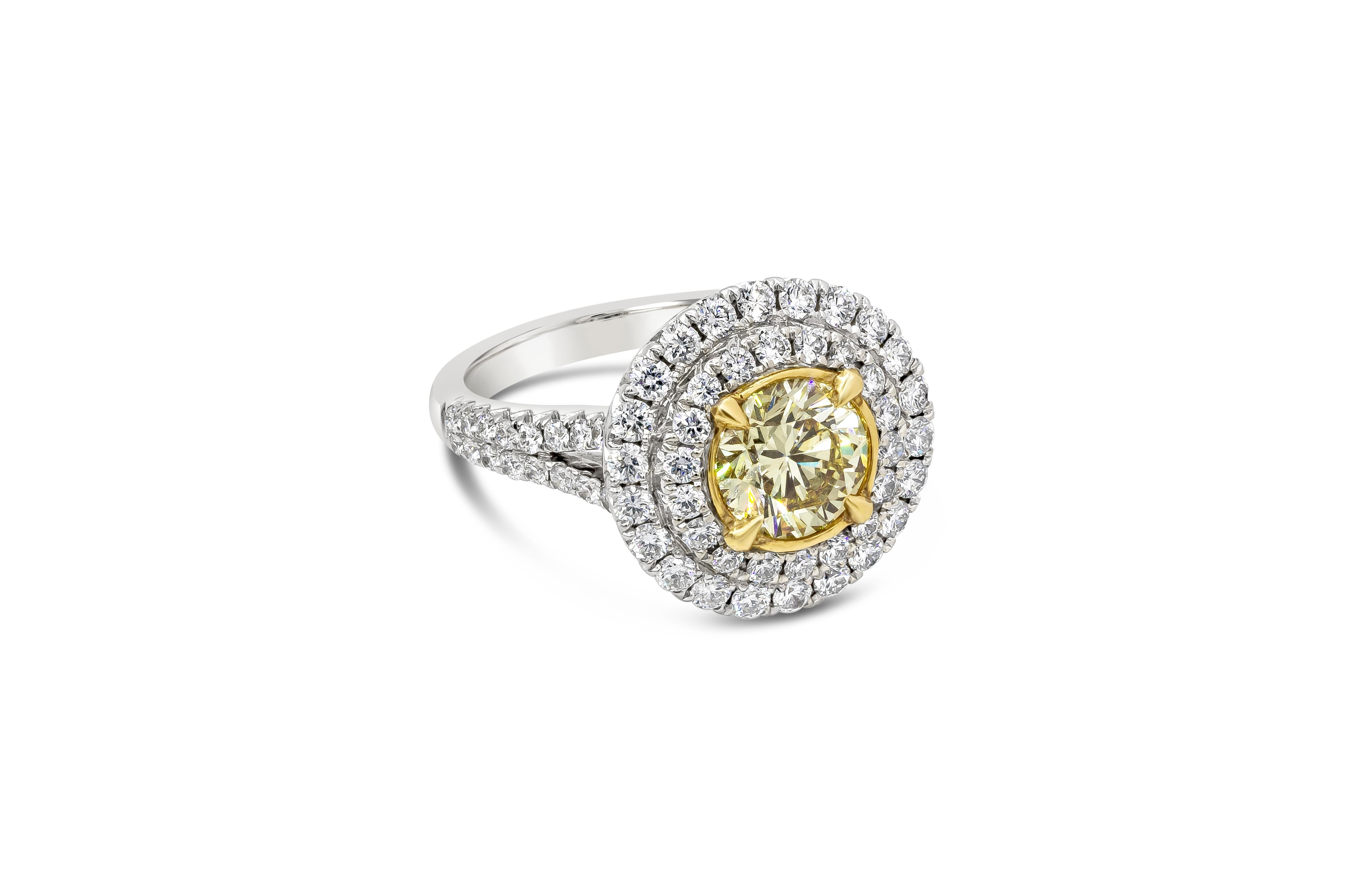 A spectacular engagement ring style showcasing a 1.41 carat round shape diamond certified by GIA as Fancy Light Yellow color, SI2 in clarity. Center diamond is surrounded by two rows of round brilliant diamonds in an 18k white gold split shank