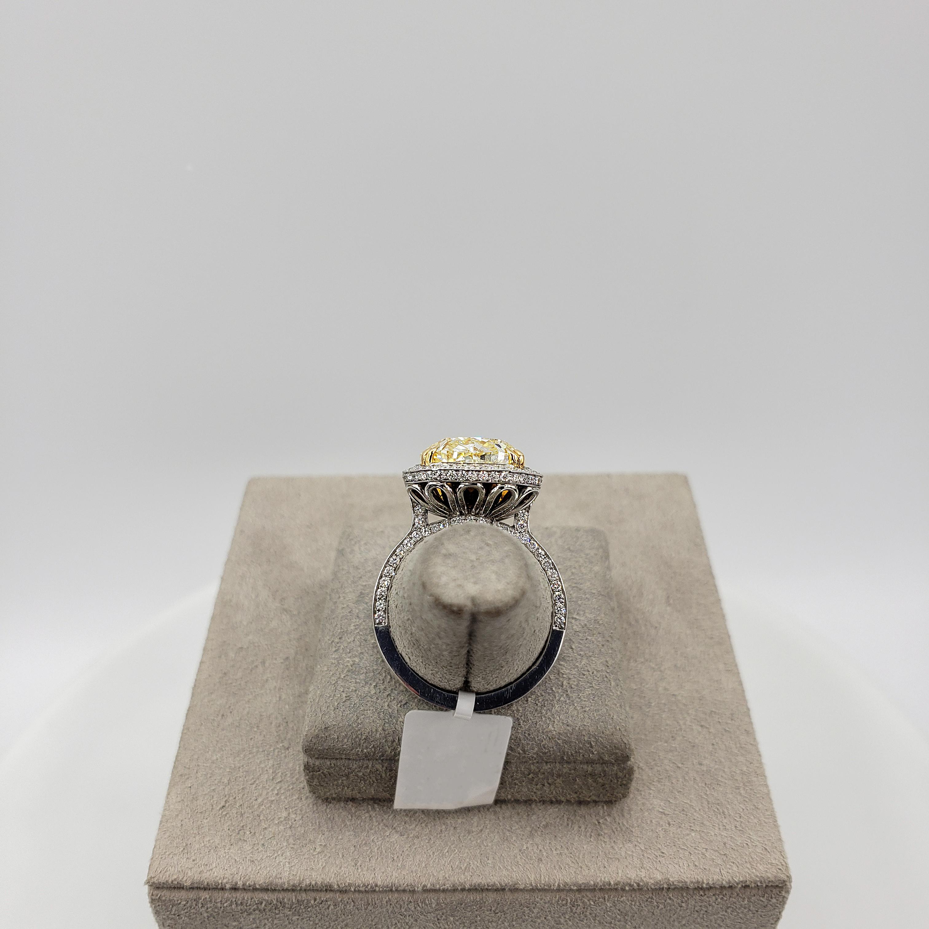 Women's GIA Certified 7.64 Carat Cushion Cut Fancy Yellow Diamond Halo Engagement Ring For Sale