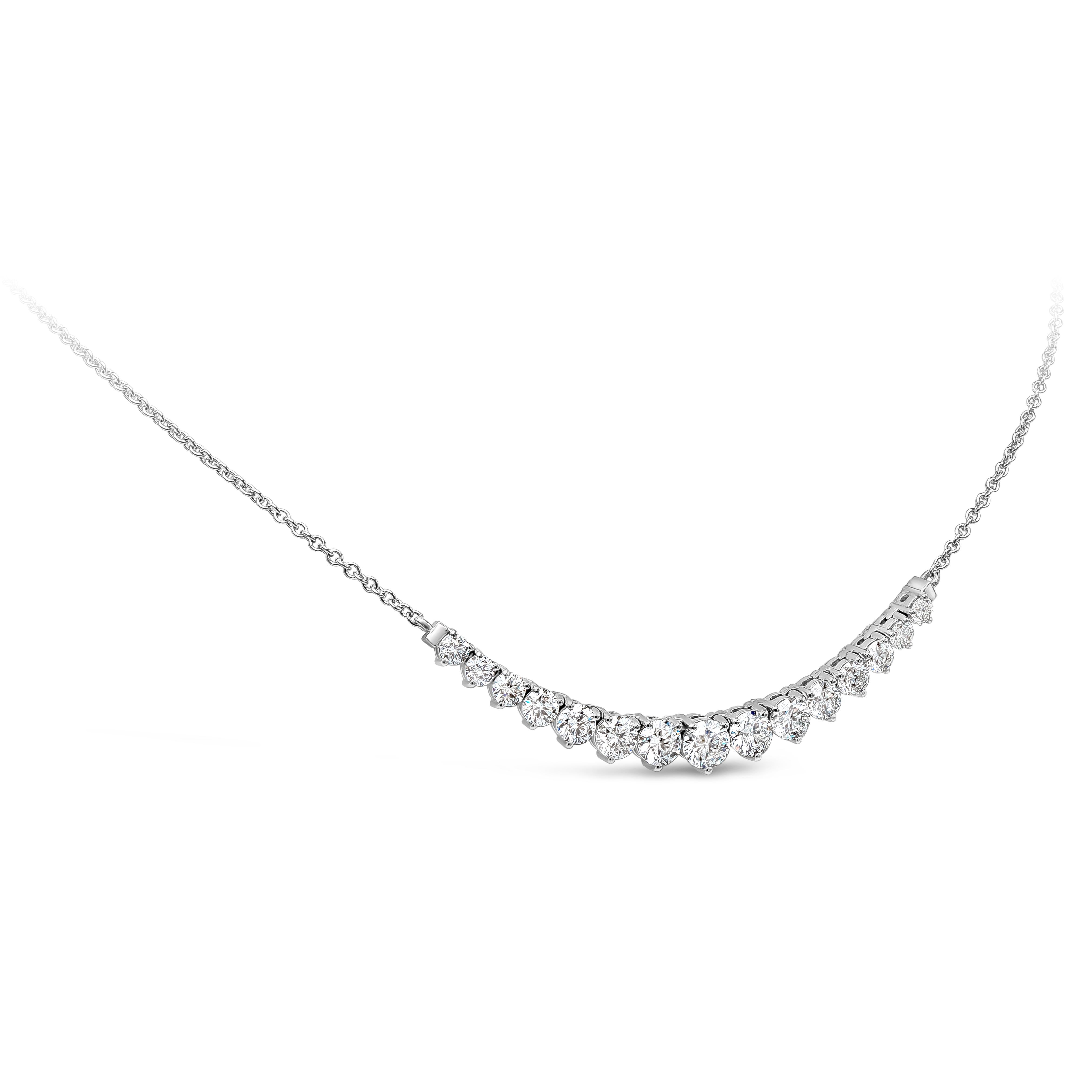 A fashionable mini riviere style necklace showcasing graduating round brilliant round cut diamond weighing 2.85 carats total and are approximately F-G color, SI-I1 clarity, set in a classic three prong basket setting. Finely made in 14k and 18k