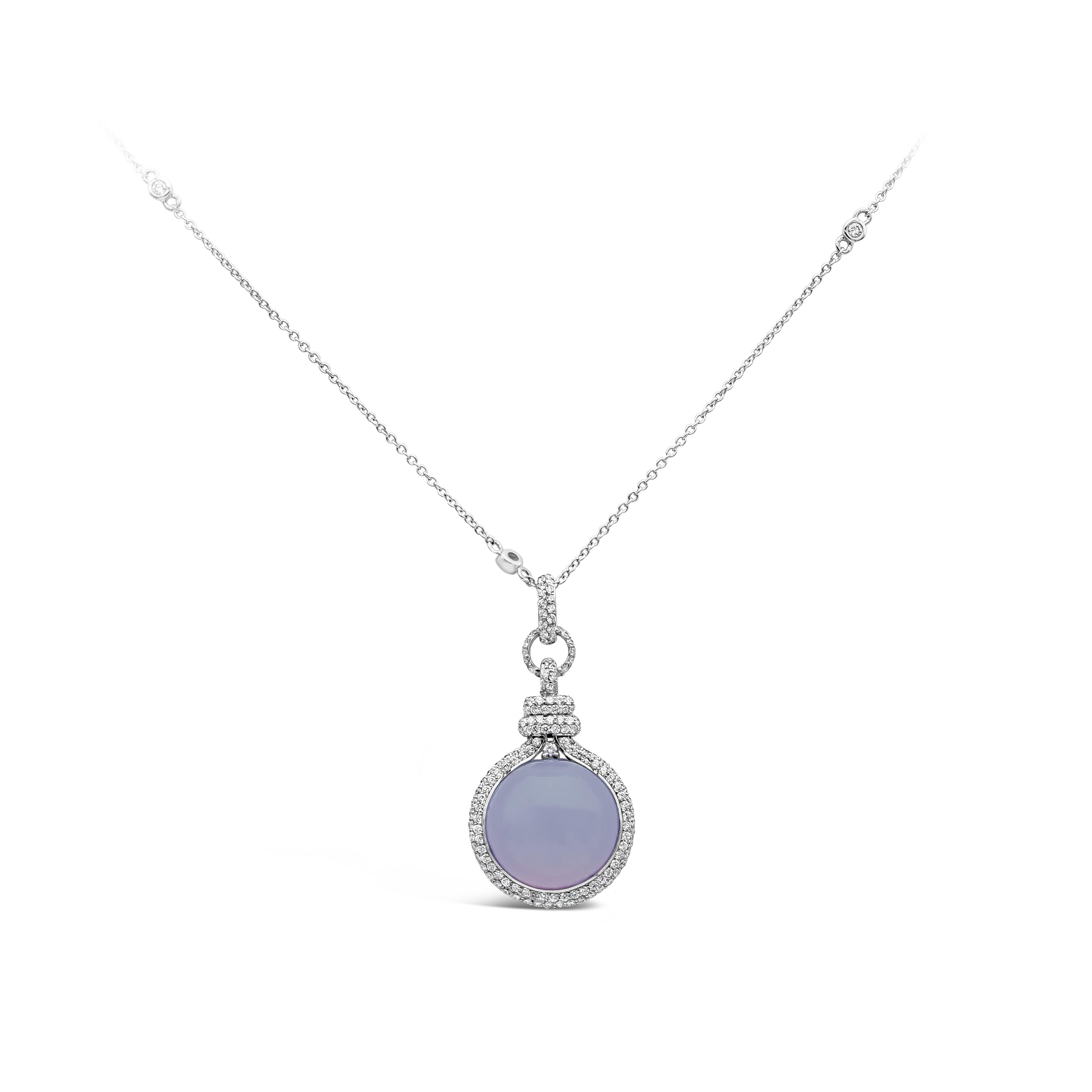 A fashionable pendant necklace showcasing a circular lavender chalcedony weighing 12.09 carat. Center stone is accented with bright round diamonds weighing 1.13 carats total, F-G color and VS clarity. Made in 18K White Gold

Roman Malakov is a