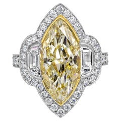 Anillo de compromiso con halo de diamantes amarillos talla marquesa certificado por GIA de 5,43 quilates