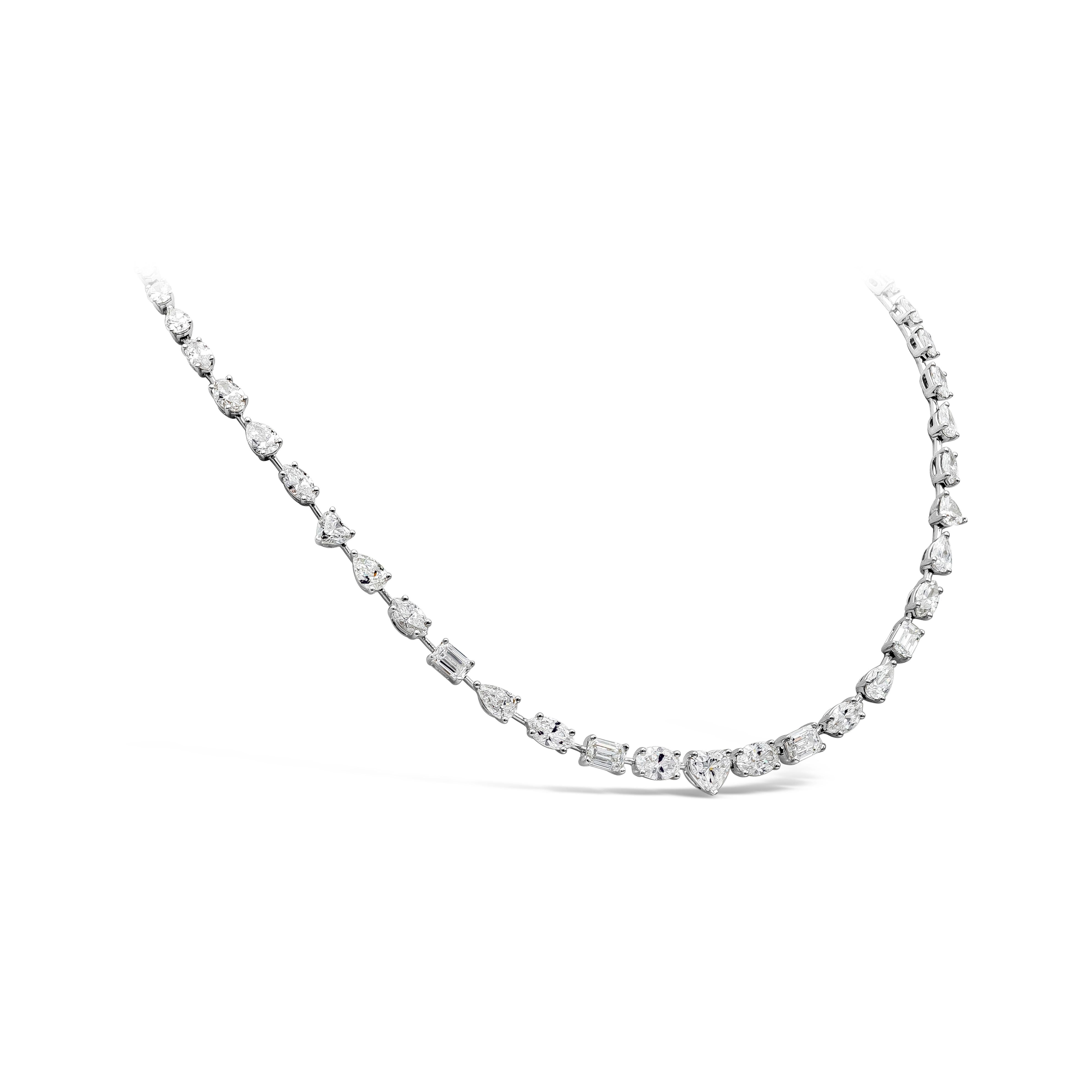 Elegantly made diamond tennis necklace showcasing a row of mixed cut pear, heart shape, oval, emerald cut diamonds that weighs 20.42 carats total, D-G color VS-SI in clarity. This sophisticated piece measure 193mm in length. The weight of this