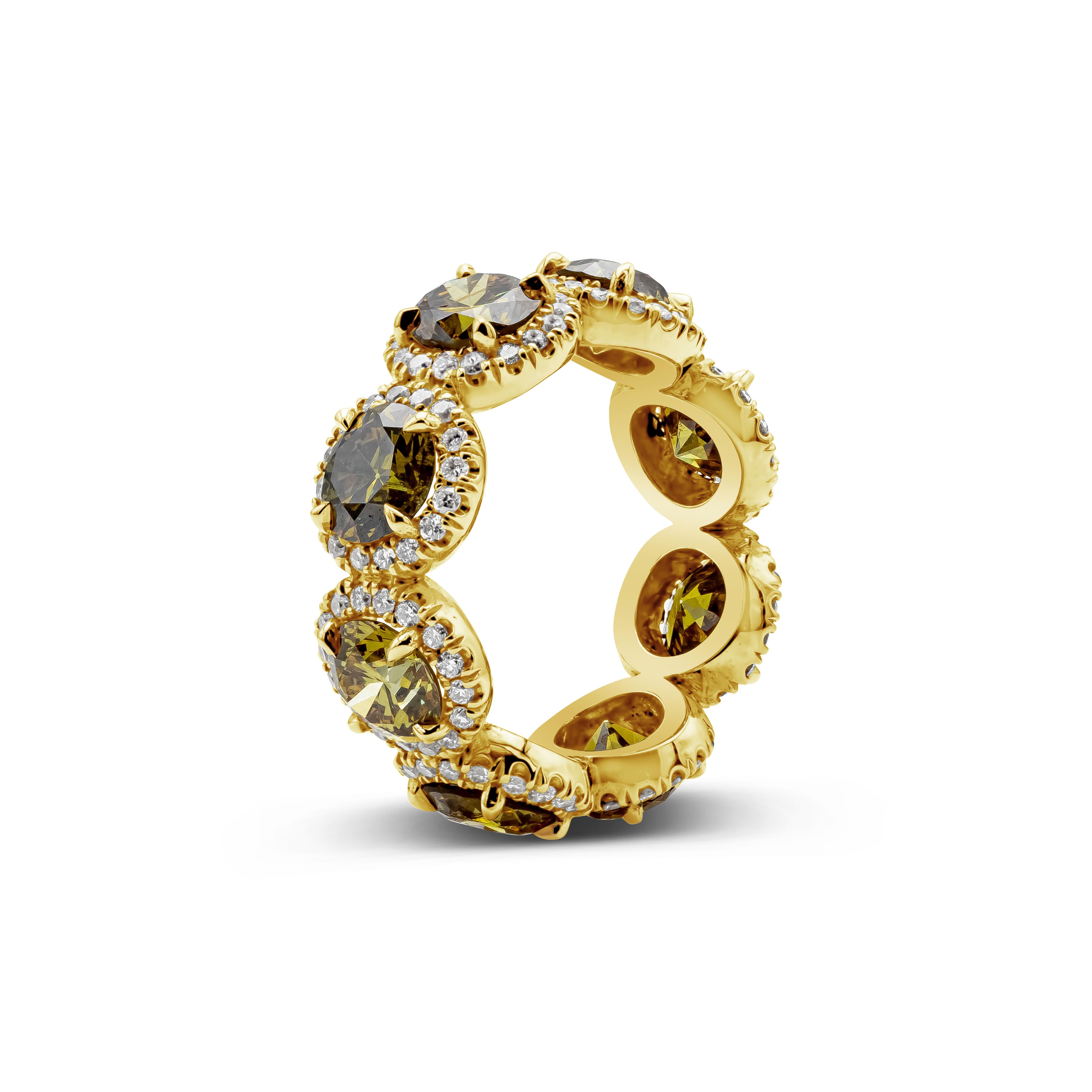 An important and color-rich piece showcasing natural round deep green and yellow diamonds weighing 5.70 carats total, each surrounded by a single row of round white diamonds. Accent diamonds weigh 0.85 carats total. Set in a polished 18K yellow gold
