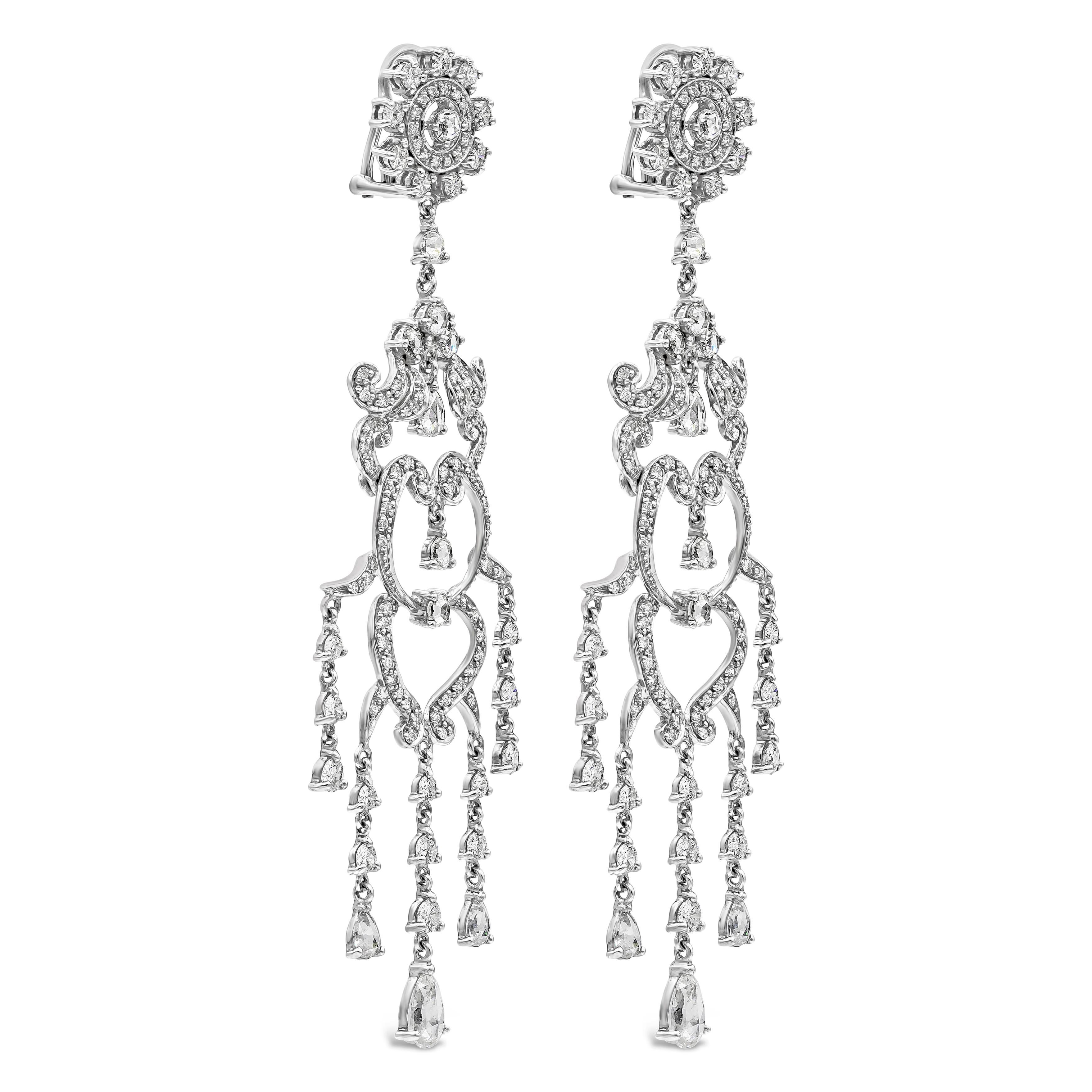 Features a combination of brilliant and rose cut diamonds, set in an intricate and delicate open-work chandelier design. Diamonds weigh 6.82 carats total. Made in 18k white gold. 3.5 inches in length.

Style available in different price ranges.