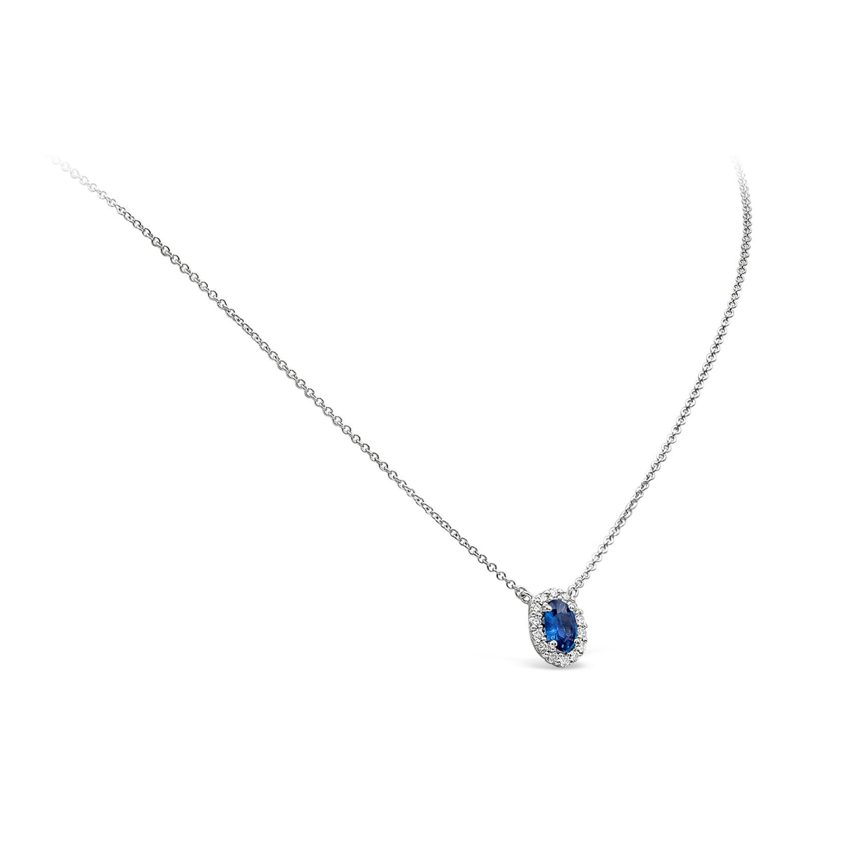 Contemporary 0.73 Carats Oval Cut Blue Sapphire and Diamond Halo Pendant Necklace  For Sale