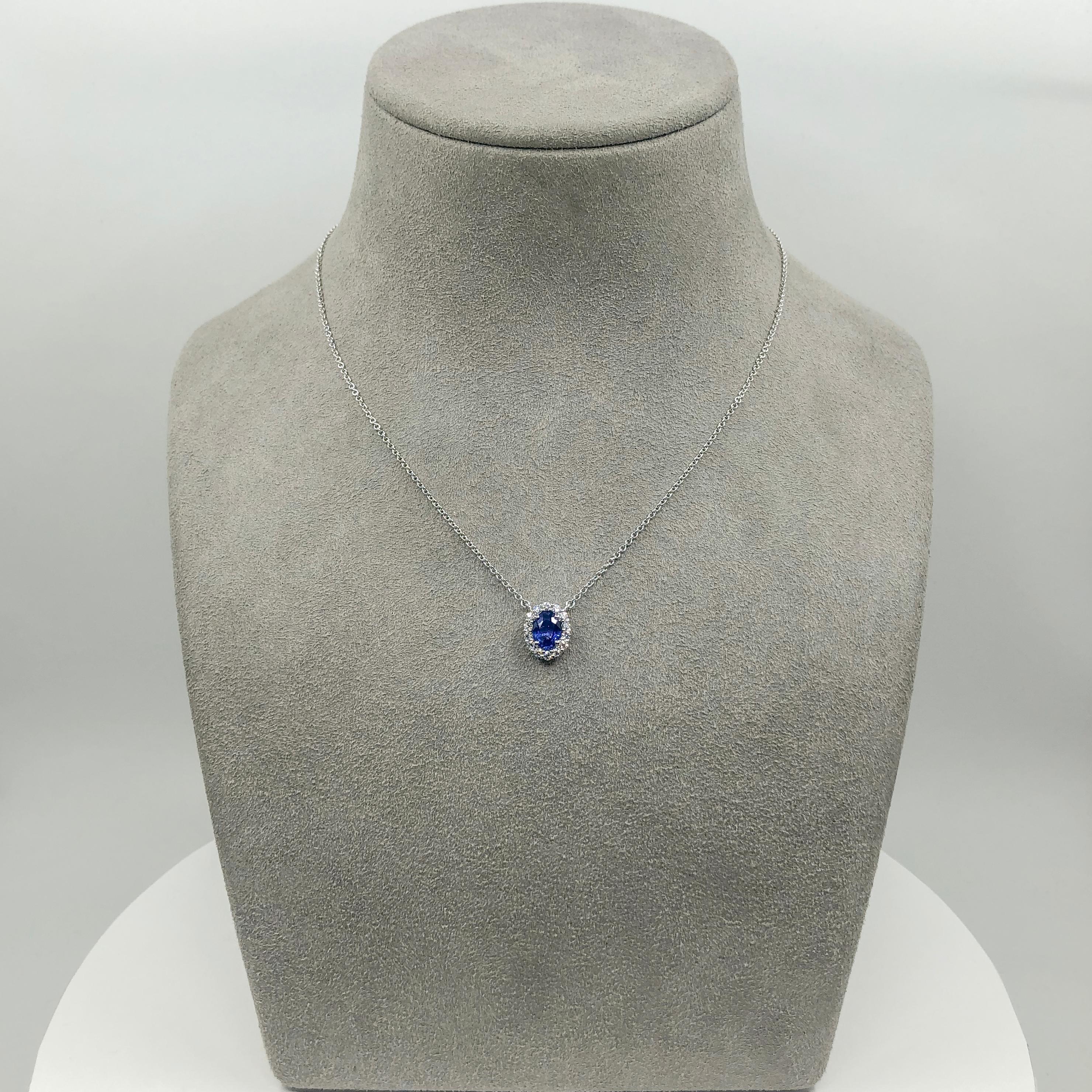Women's 0.73 Carats Oval Cut Blue Sapphire and Diamond Halo Pendant Necklace  For Sale