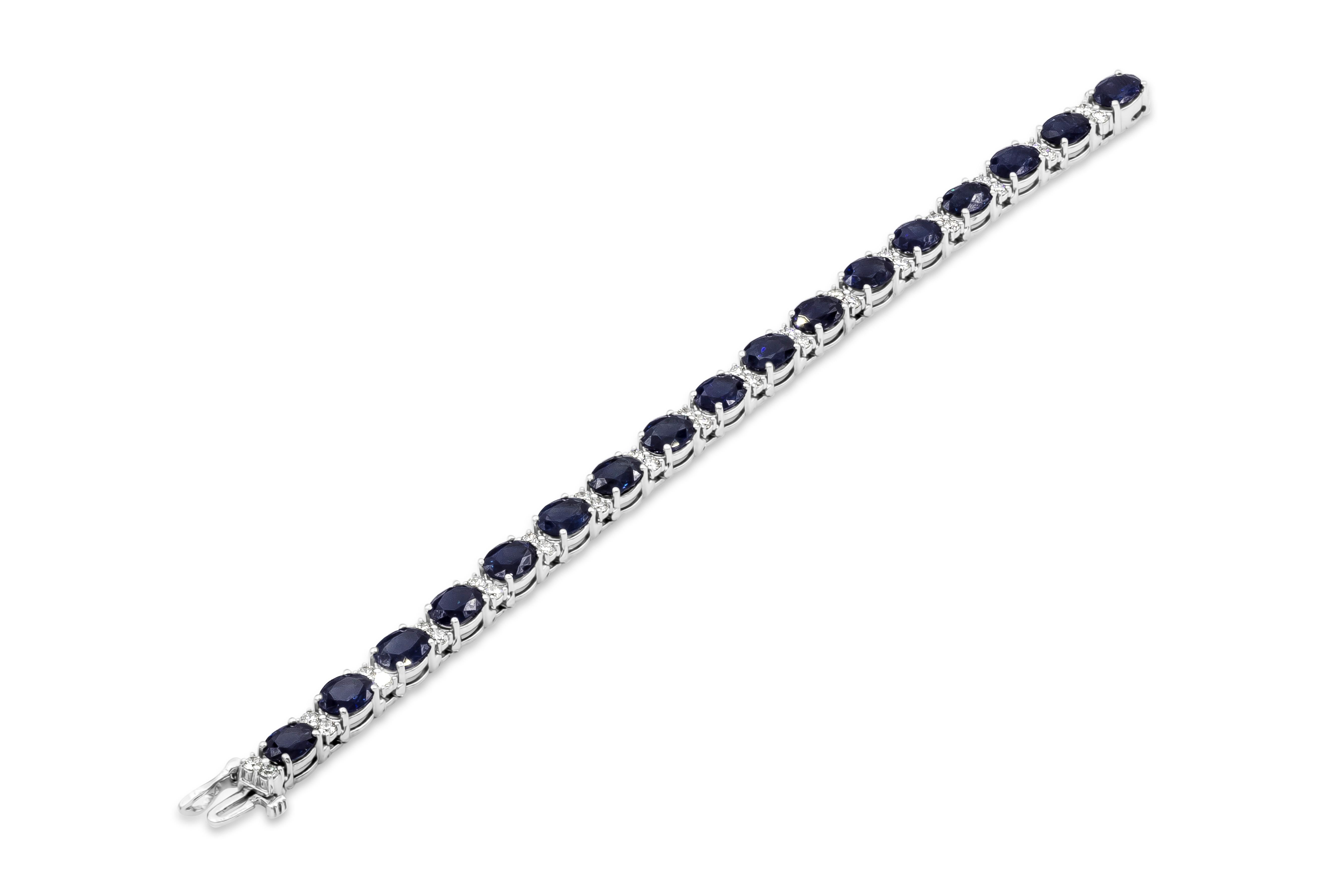 A fashionable and color-rich tennis bracelet showcasing oval cut blue sapphires weighing 28.20 carats total, spaced by round brilliant diamonds weighing 2.38 carats total. Made in 18k white gold. 

Style available in different price ranges. Prices