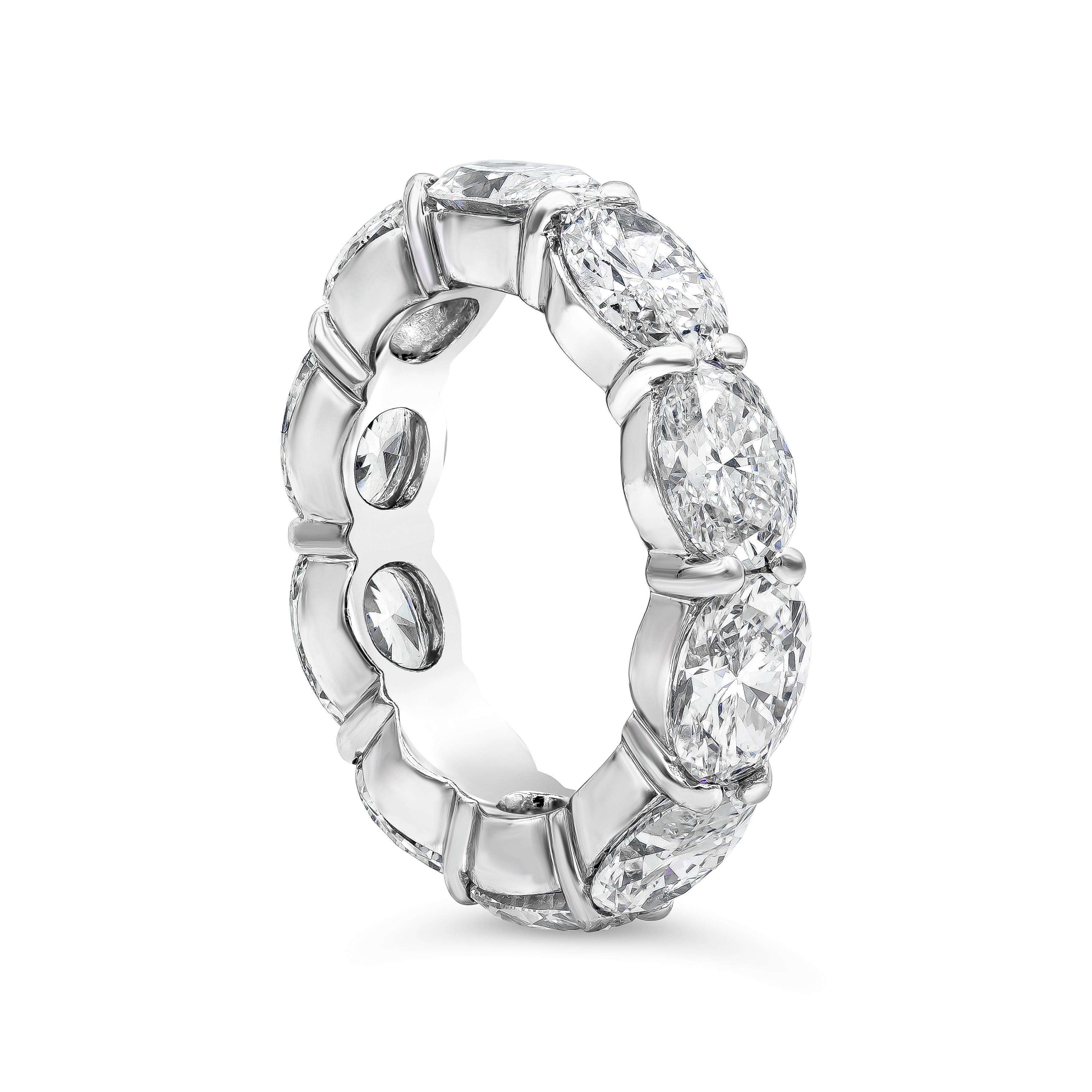 A very fashionable wedding band style showcasing a row of brilliant oval cut diamonds weighing 7.40 carats total, set in a non-traditional east-west (horizontal) design made in platinum. Size 6.5 US.

Roman Malakov is a custom house, specializing in
