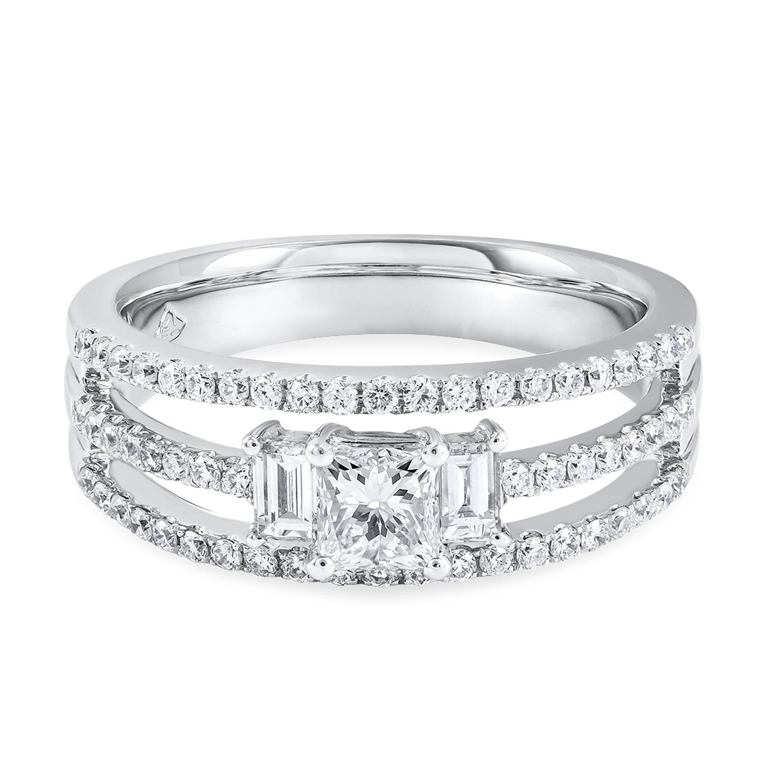 Featuring 0.43 carats princess cut diamond center stone. Flanked by two baguette diamonds weighing 0.19 carats total. Shank made in 18k white gold in a three-row open-work design encrusted with brilliant round diamonds that gradually meet as it goes