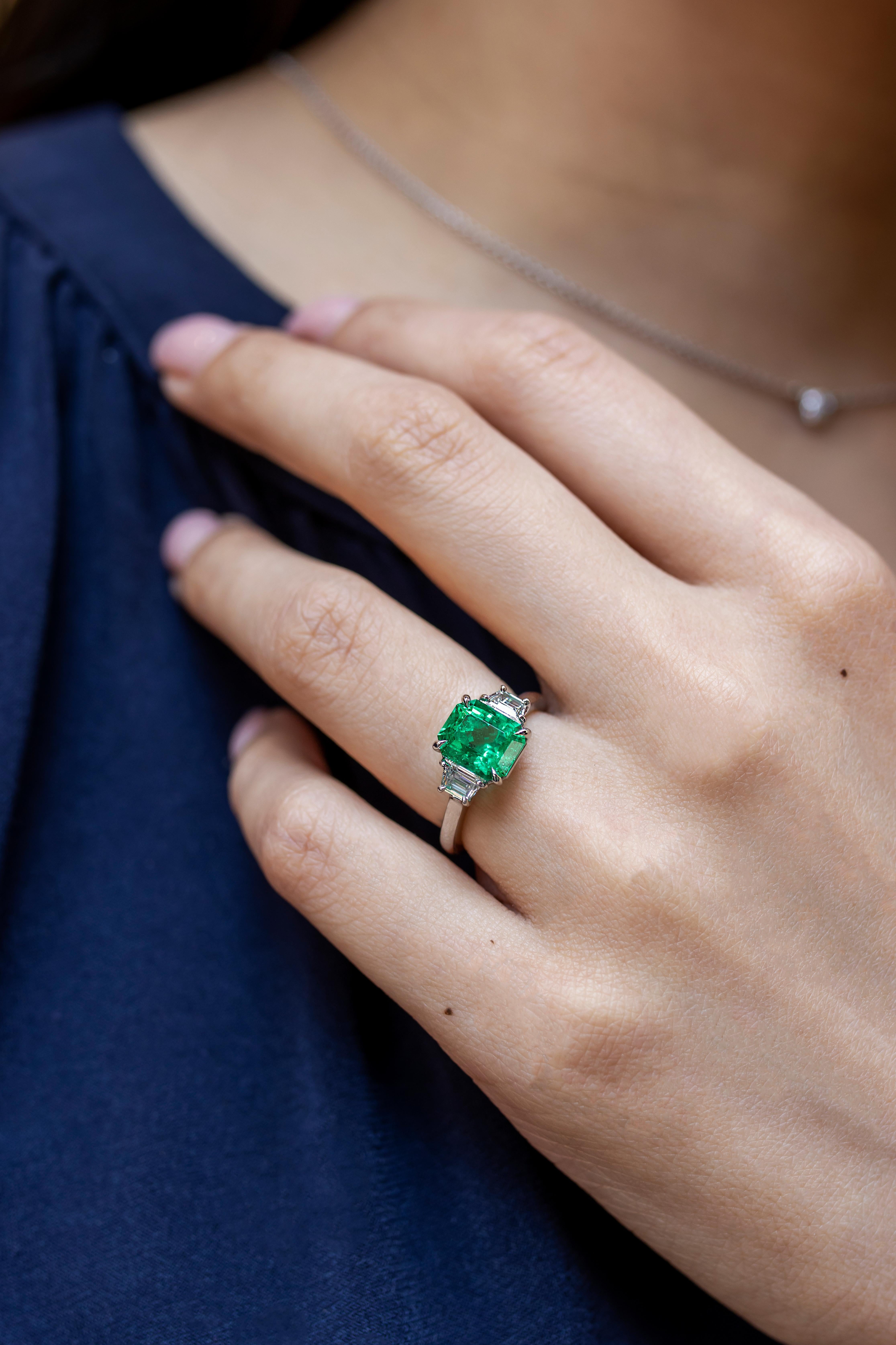 diamond ring with emerald side stones