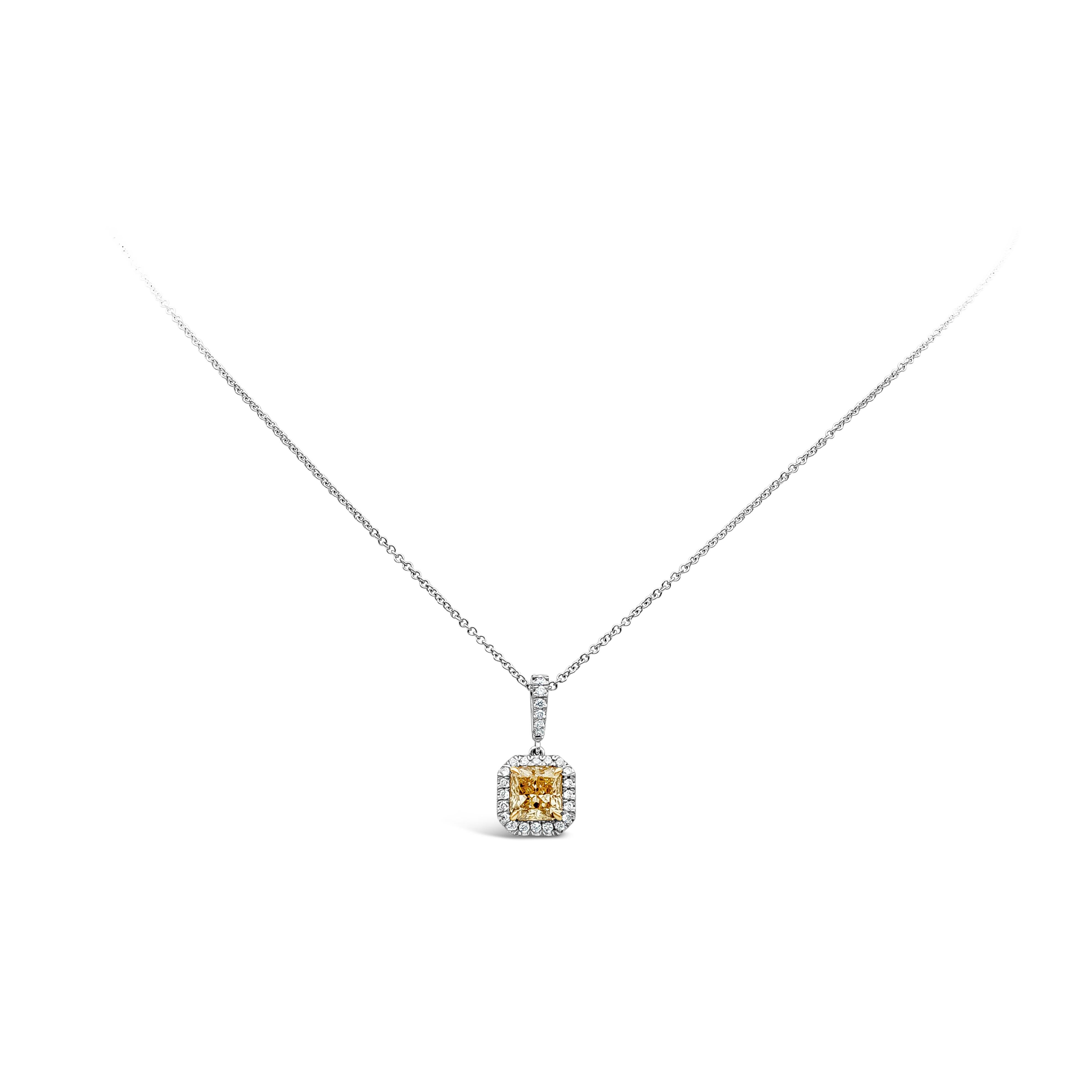 This beautiful 1.04 carat radiant cut yellow diamond, set by yellow gold prongs, is surrounded by brilliant round diamonds. Hanging by a diamond encrusted bail on a 18k white gold chain. 

Style available in different price ranges. Prices are based