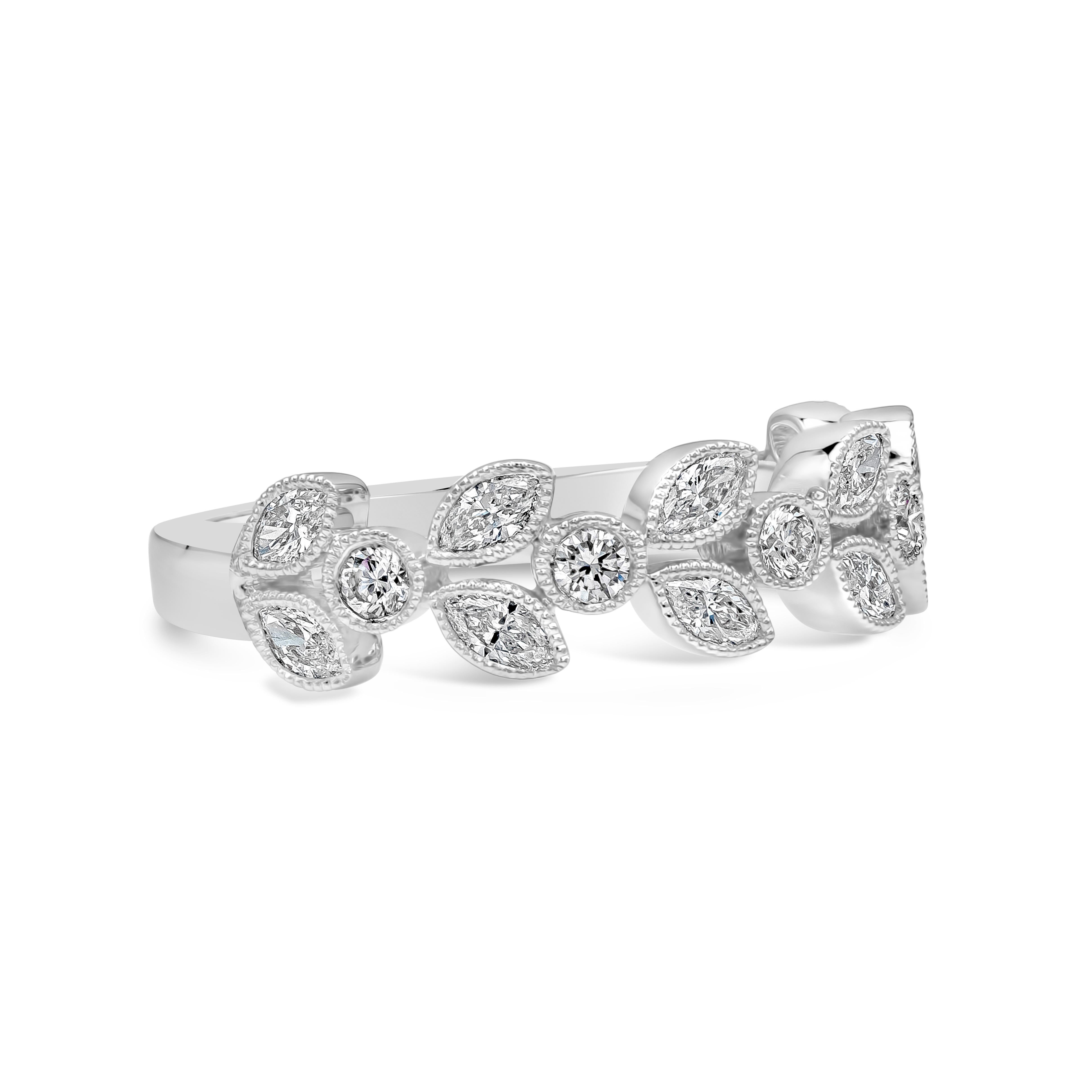 A fashionable ring showcasing a cluster of round and marquise cut diamonds, bezel set in a leaf design with beaded edges. Diamonds weigh 0.71 carats total, F-G Color and Vs in Clarity. Made in 18K White Gold. Size 6.5 US resizable upon