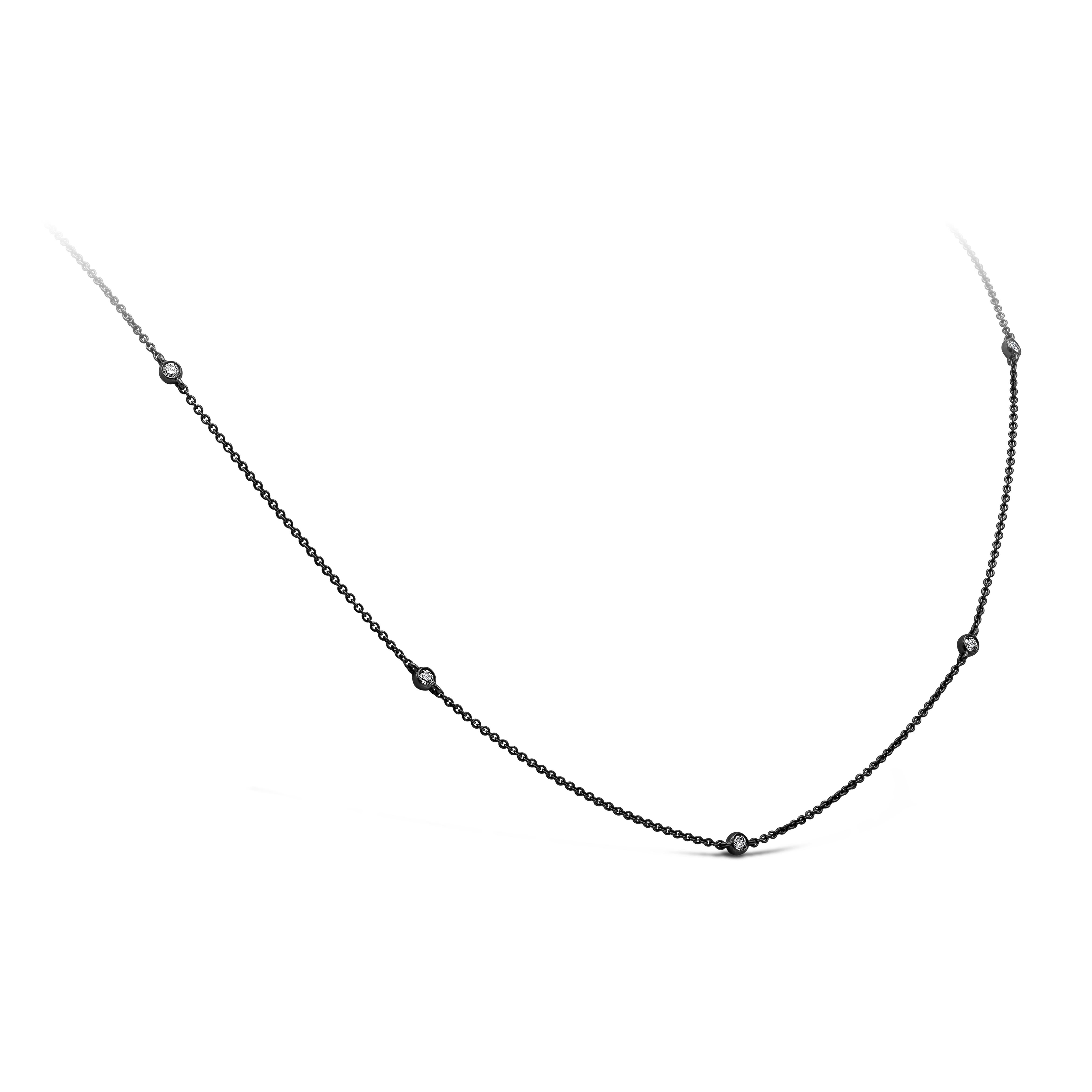 A chic piece of jewelry showcasing a round brilliant diamonds, spaced evenly in an 18K black rhodium finished chain. Diamonds weigh 0.32 carats total. Necklace length is 22 inches but can be worn as a 20 inch necklace as well. 

Roman Malakov is a