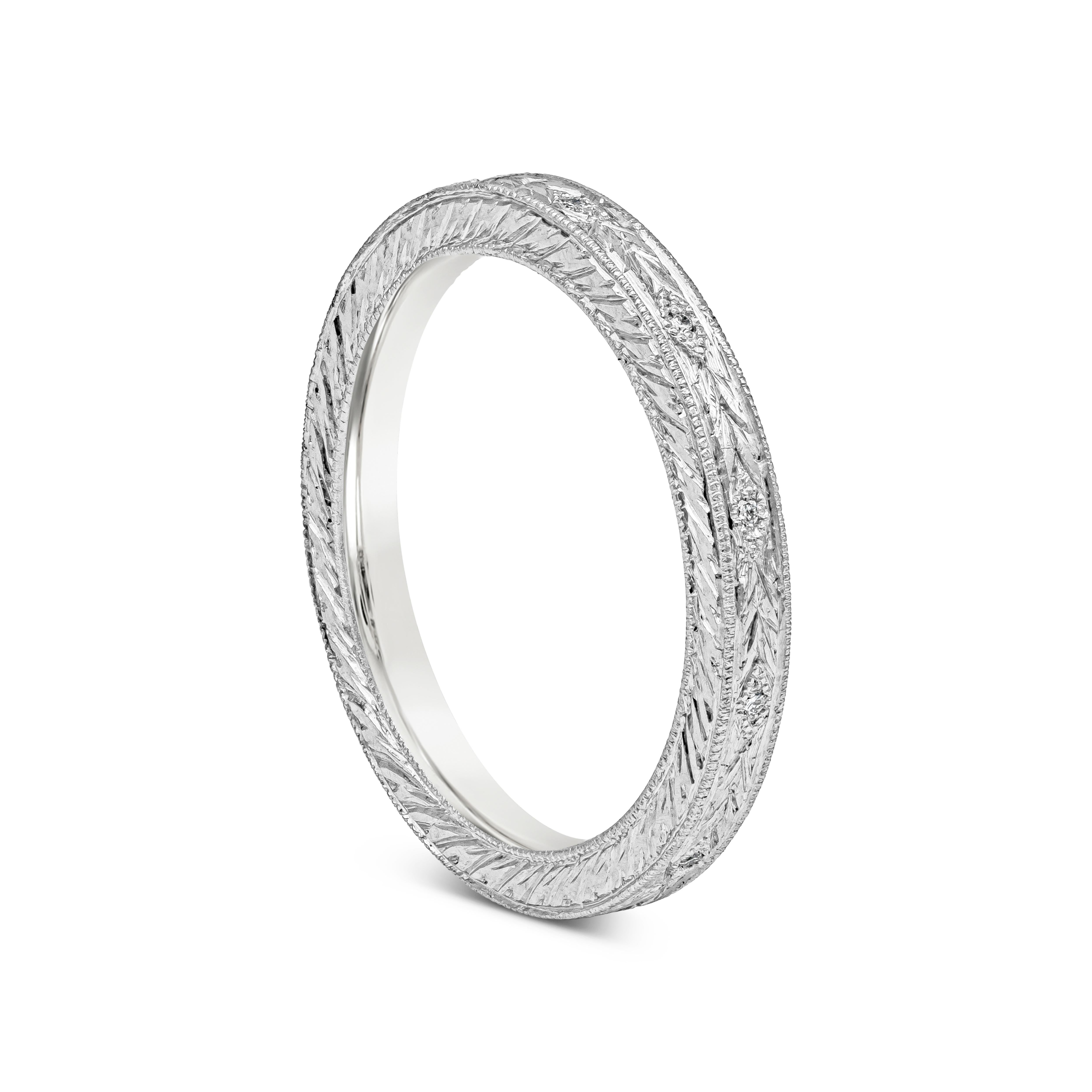 A beautiful and intricately-designed wedding band, accented by a hand-engraved design and round brilliant diamonds. Made in platinum. 

Roman Malakov is a custom house, specializing in creating anything you can imagine. If you would like to receive