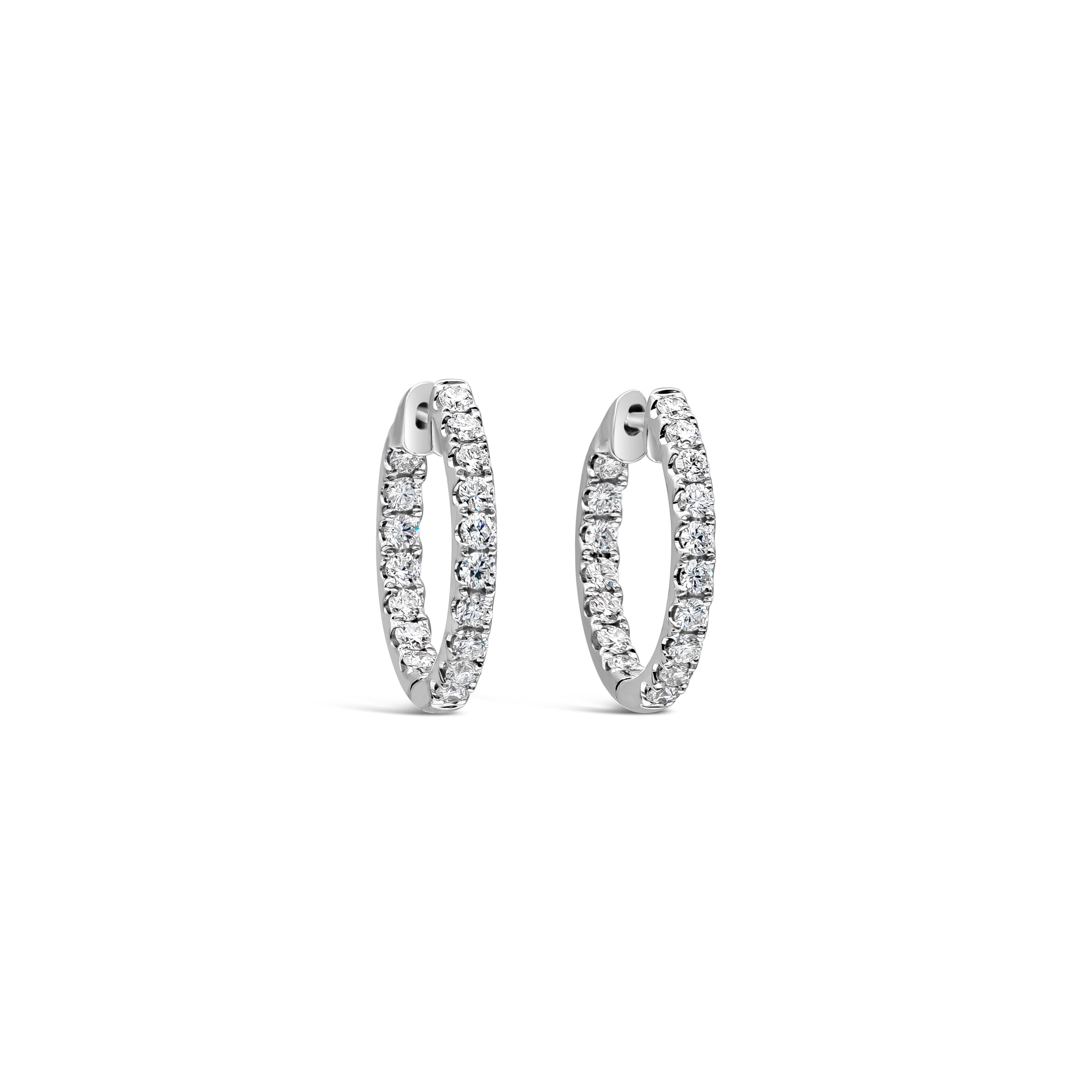 A classic and versatile style hoop earrings showcasing round brilliant diamonds weighing 1.32 carat total, F Color and VS-SI in Clarity. Set in a scalloped pave style, Made with 18K White Gold.

Roman Malakov is a custom house, specializing in