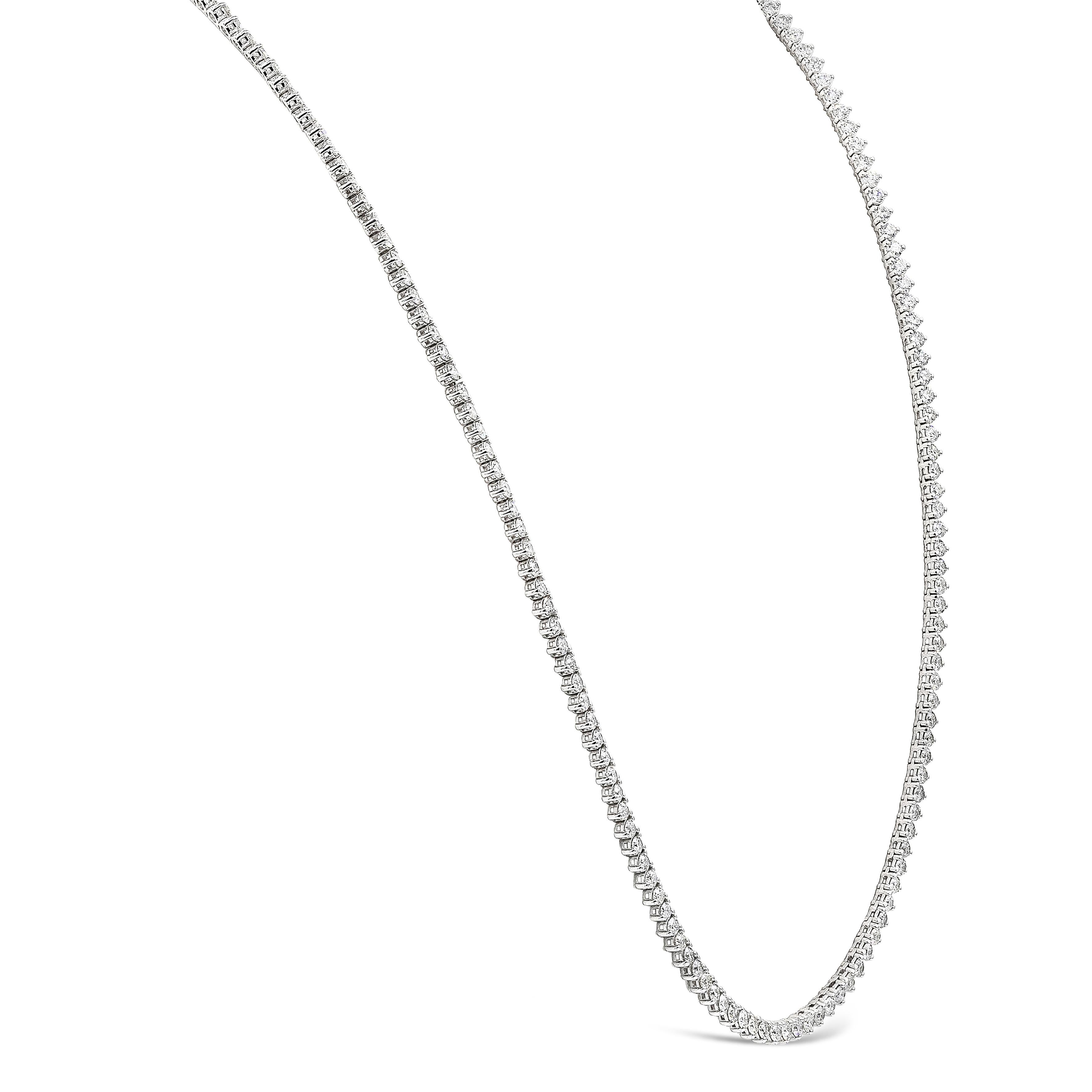 A brilliant necklace showcasing a row of round brilliant diamonds spaced evenly in a polished 18K white gold mounting. Diamonds weigh 29.00 carats total and are approximately F color, SI in clarity. Finely made in 18K white gold and 36.13 inches in