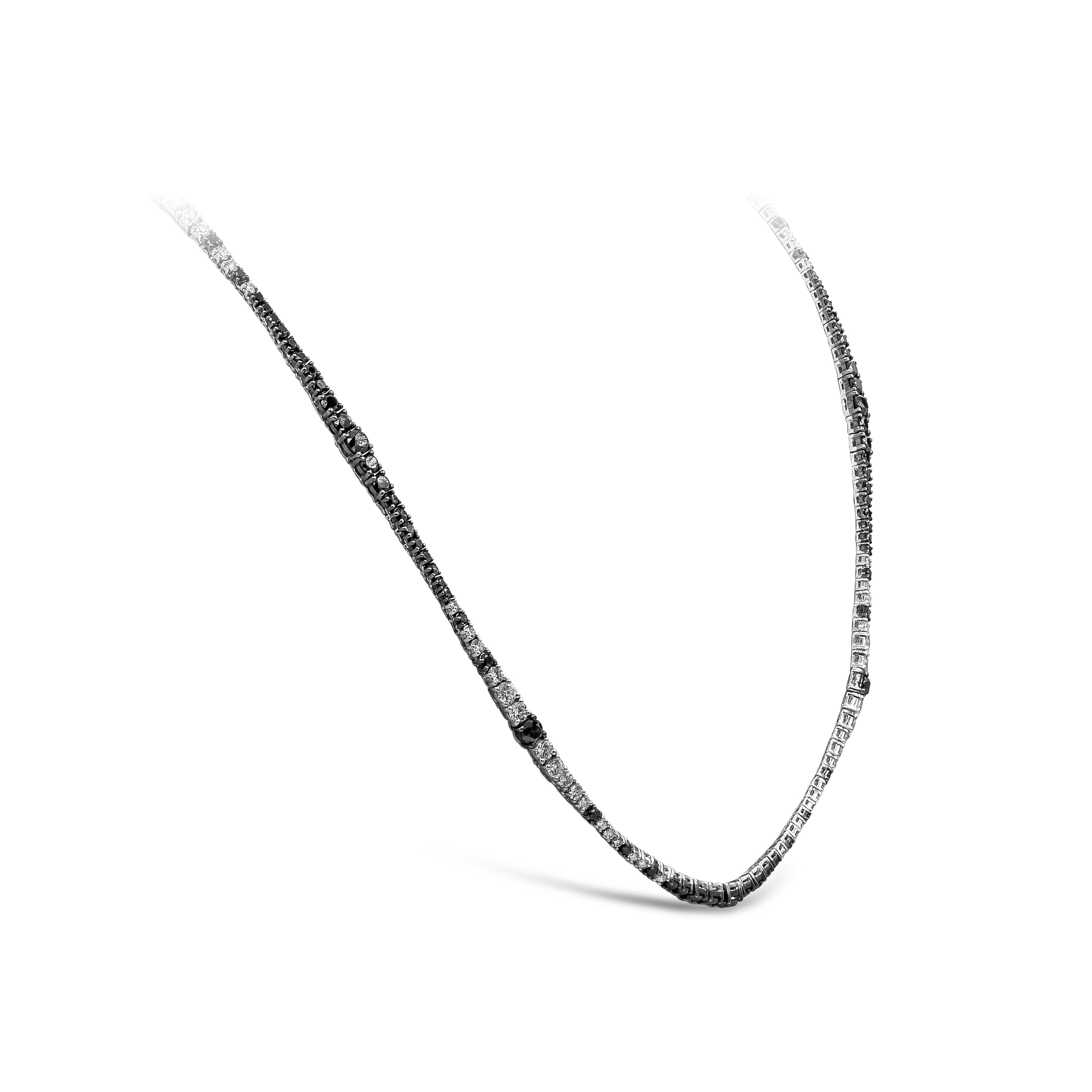 A brilliant long riviera necklace showcasing a row of white and black round diamonds, White diamonds weigh 7.77 carats total and Black diamonds weigh 14.77 carats total. Made with 18K White Gold. 32 3/4 inches in Length

Style available in different