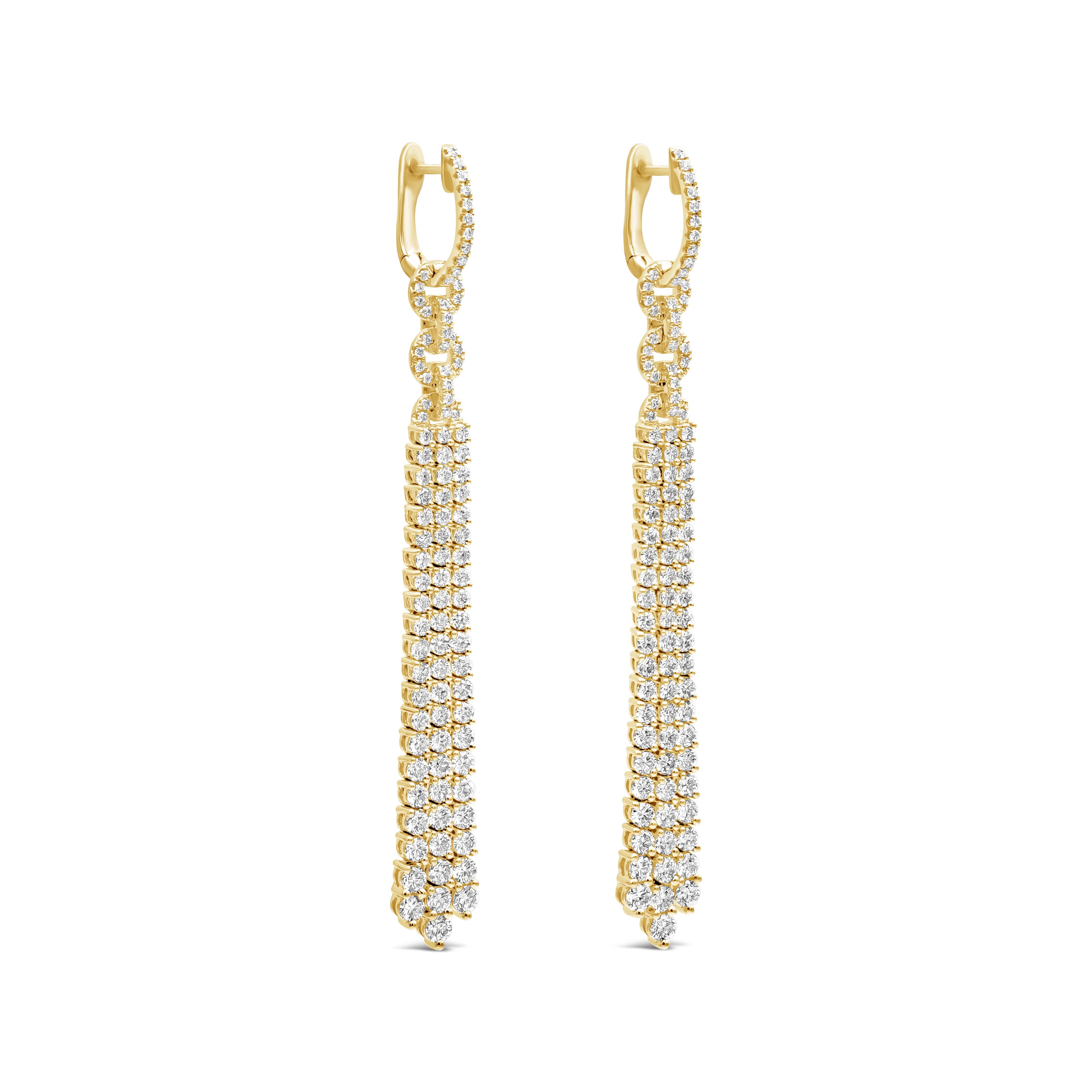 A fashionable and sophisticated piece of jewelry. Each earring showcases three strand round diamonds in yellow gold that elegantly dangled. Diamonds weigh 4.35 carats in total approximately F-G color, VS-SI in clarity. Finely made in 18k yellow
