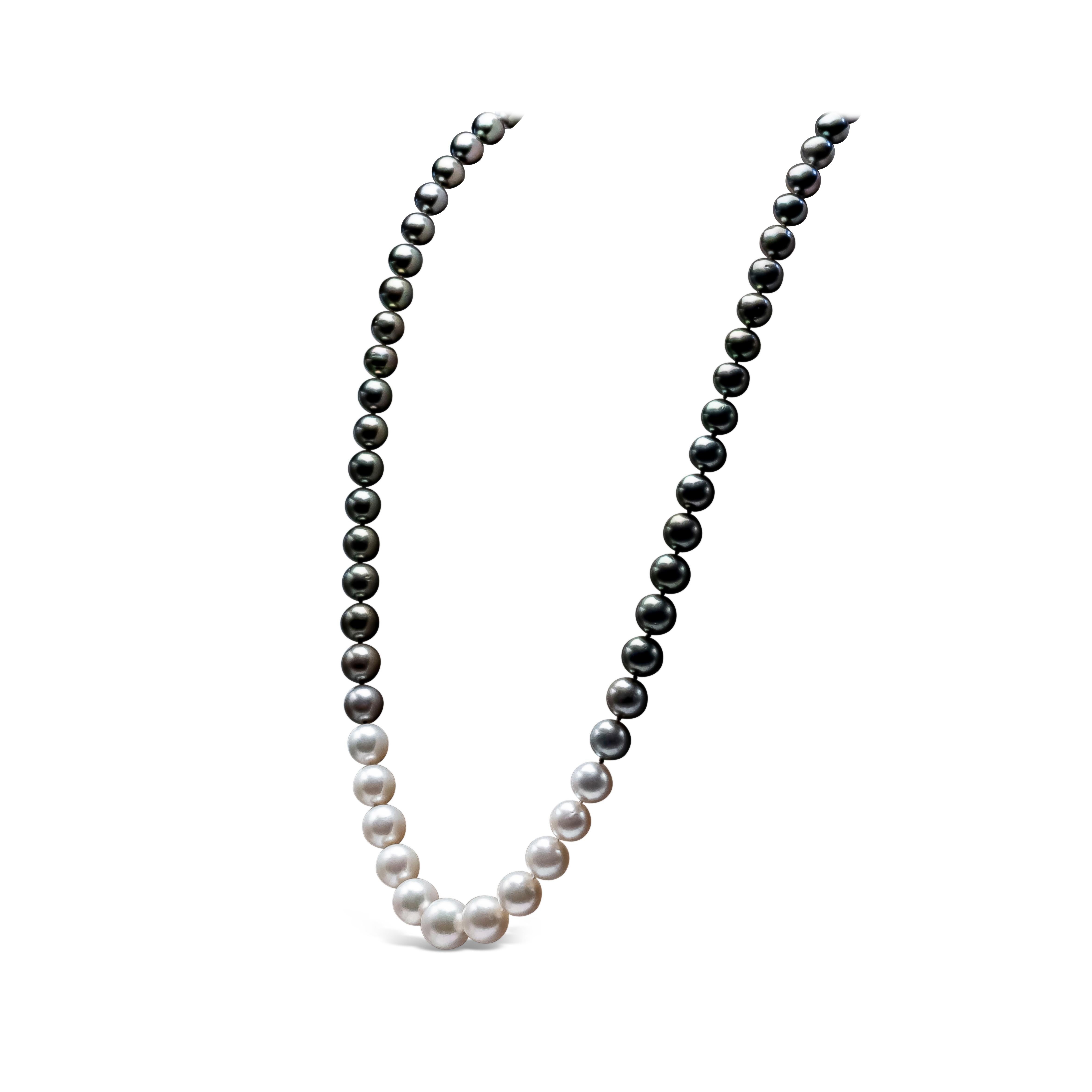 A very versatile necklace showcasing 11-16.7 mm white and black south sea pearls. This necklace has 83 pieces of south sea pearls designed in a classic opera length style and accented with a magnificent color transition of black pearls to white