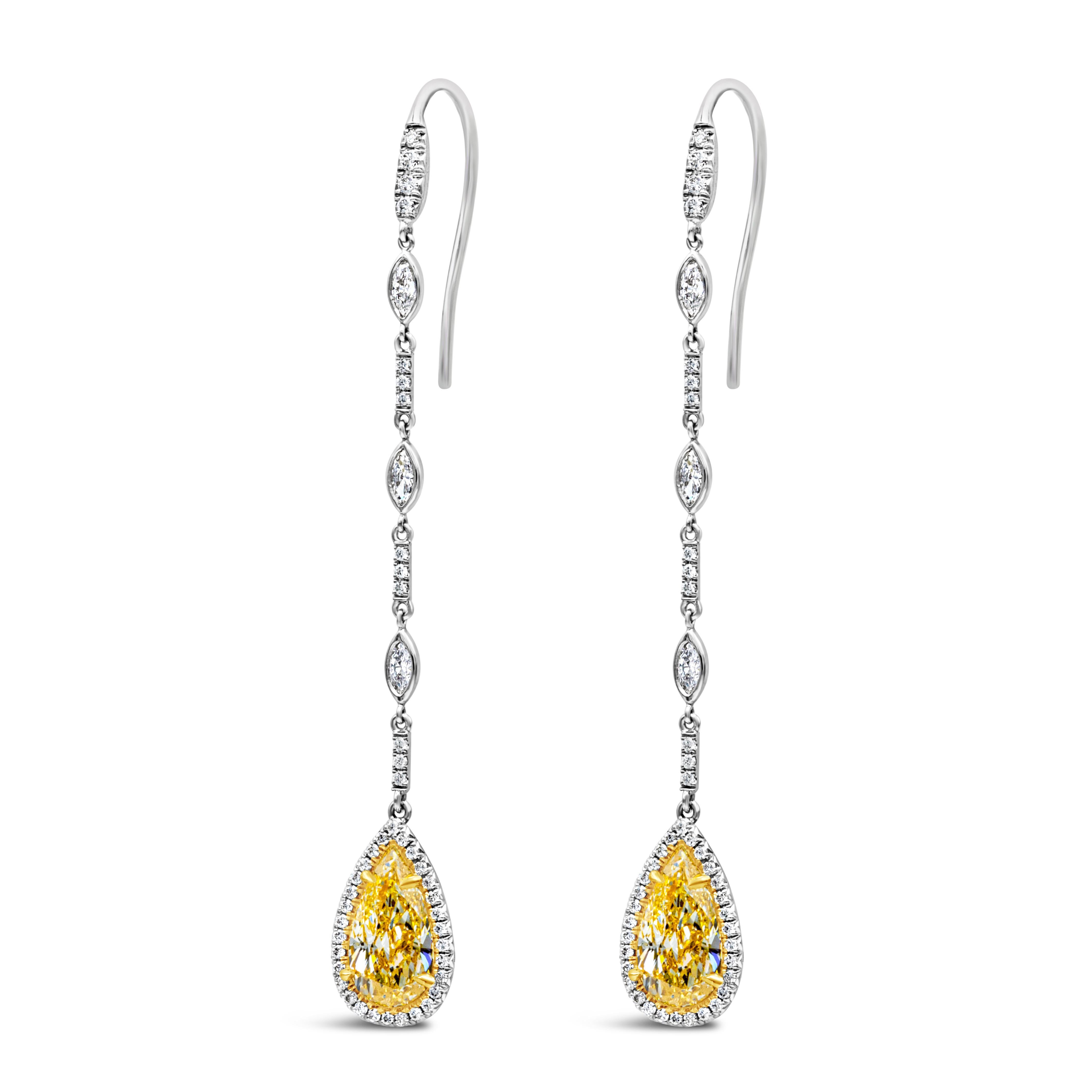 Showcases a color-rich yellow pear shape diamond weighing 3.20 carats total, surrounded by a single row of round brilliant diamonds. Suspended on an platinum chain accented with marquise cut diamonds. Accent diamonds weigh 0.58 carats total.

Roman