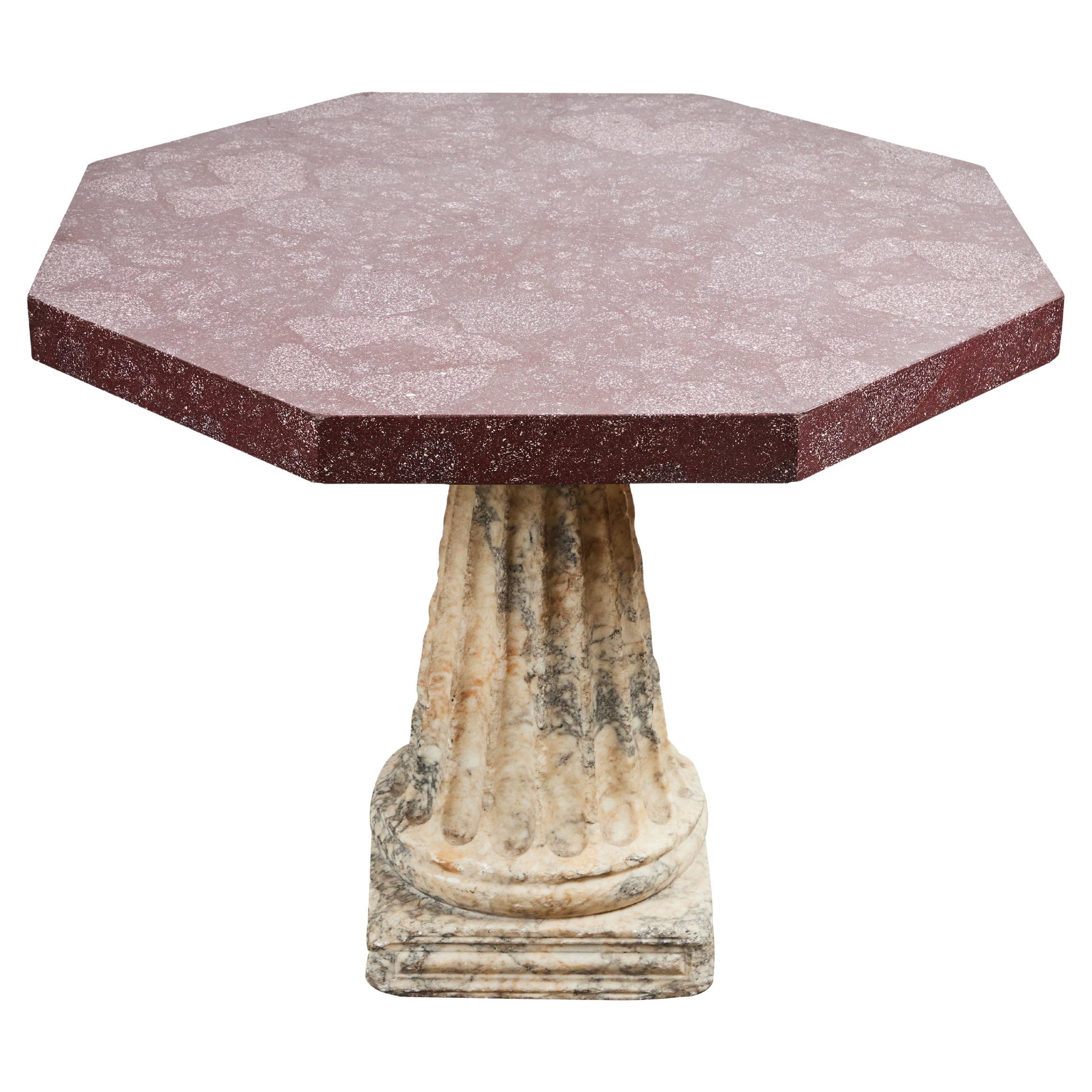 An exceptional table made of a Roman pavonazzo marble base, originally from a labrum, circa 1st/2nd century, with a later porphyry veneered top.