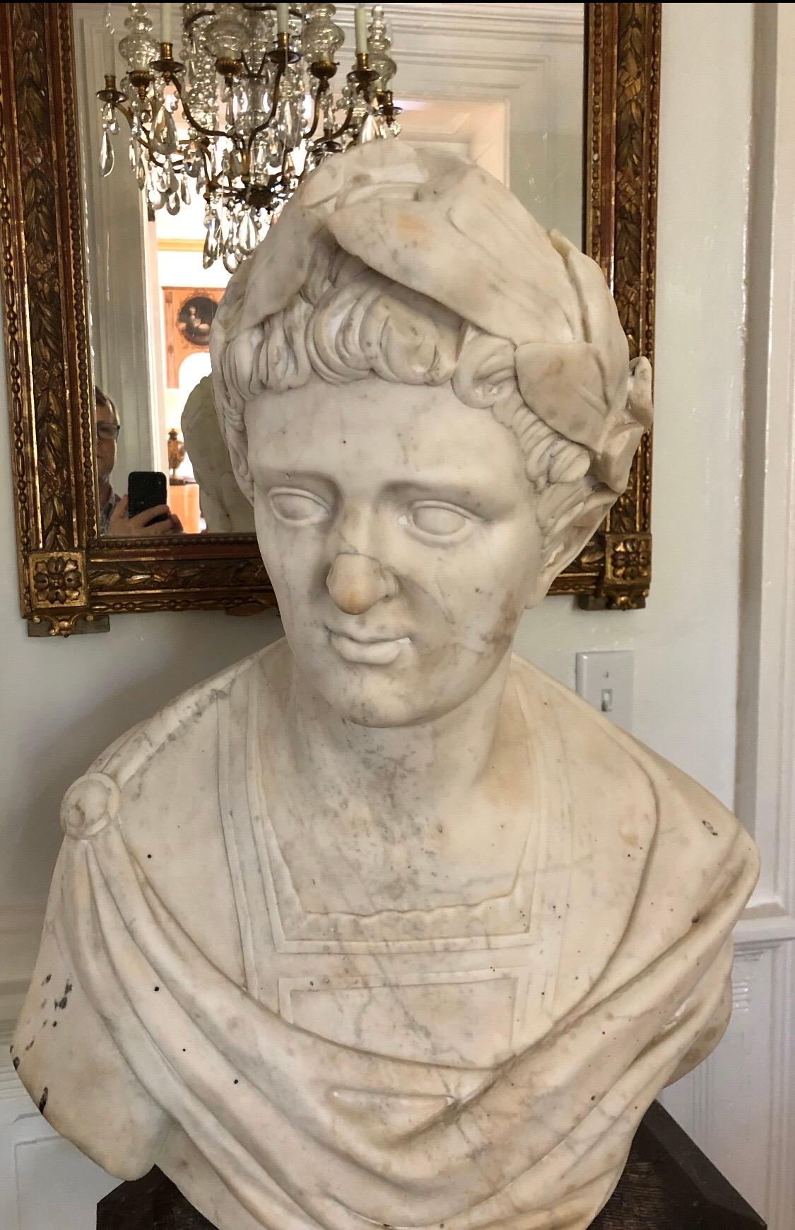 This Classical Roman marble bust of a Caesar is life-size with fine detailed carving.