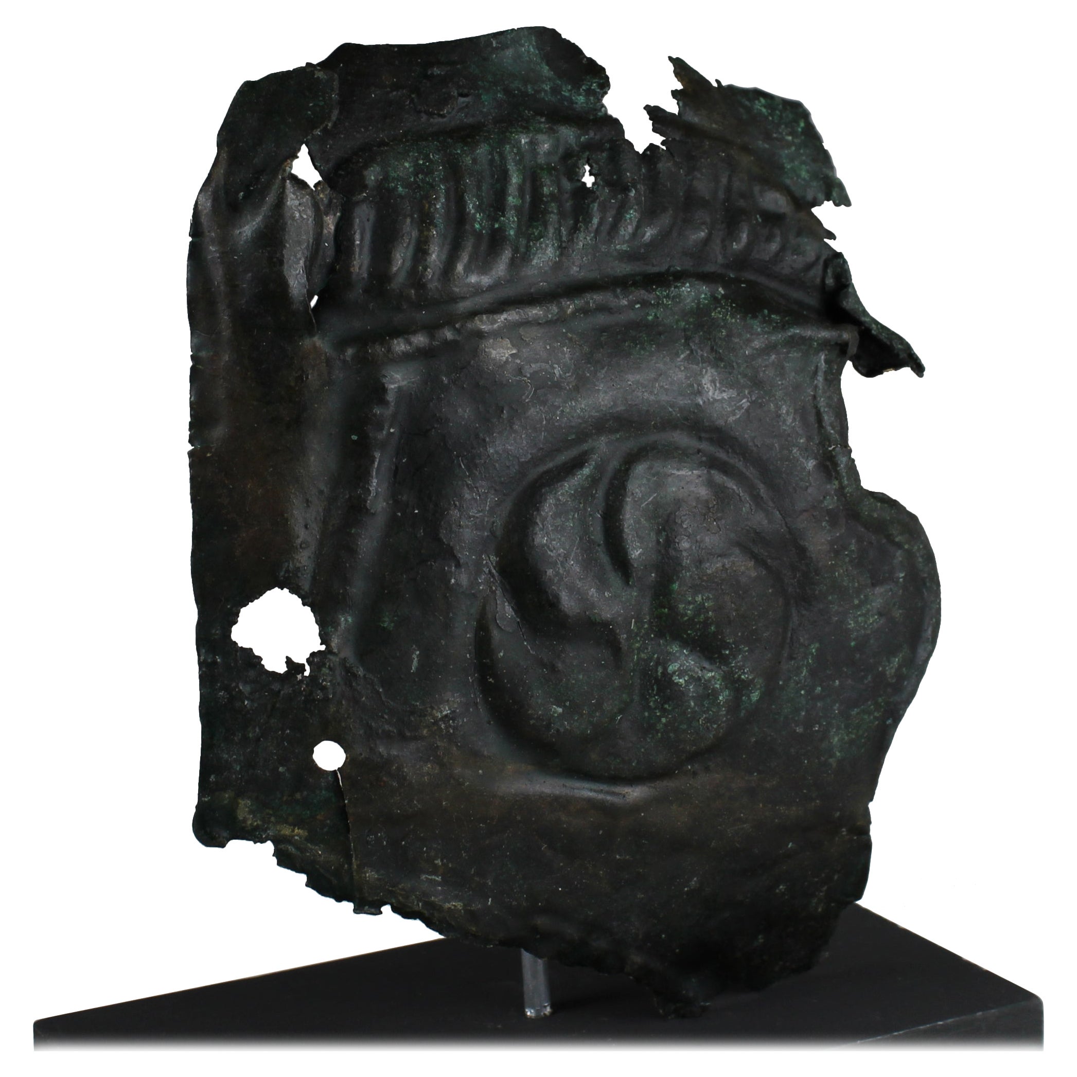 Roman military cheek piece of a helmet fragment with shield ornament