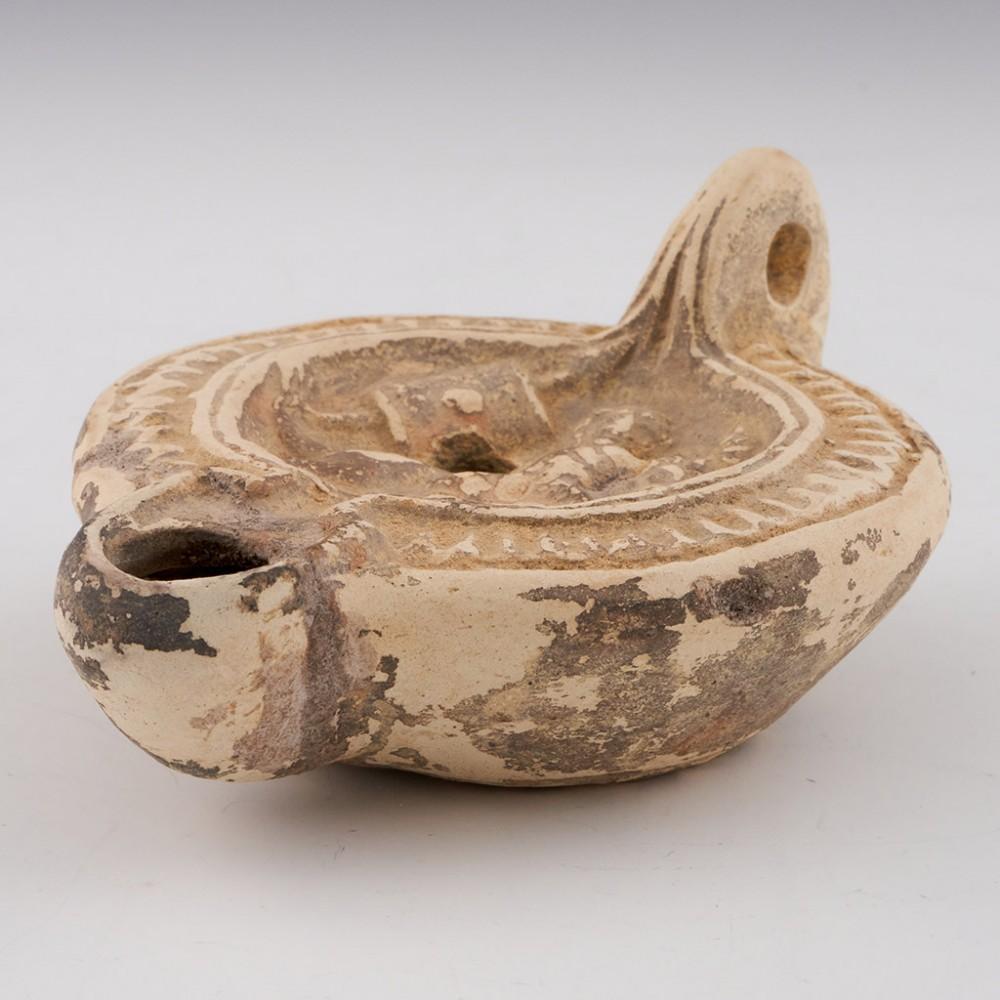 Roman Oil Lamp Mediterranean to Holy Land Region, 2nd-3rd Century AD

Additional Information:
Material: Clay, terracotta
Period: Mid to late Roman Imperial
Date: 2nd to 3rd century AD
Origin: Mediterranean basin to Holy Land regions
Features and