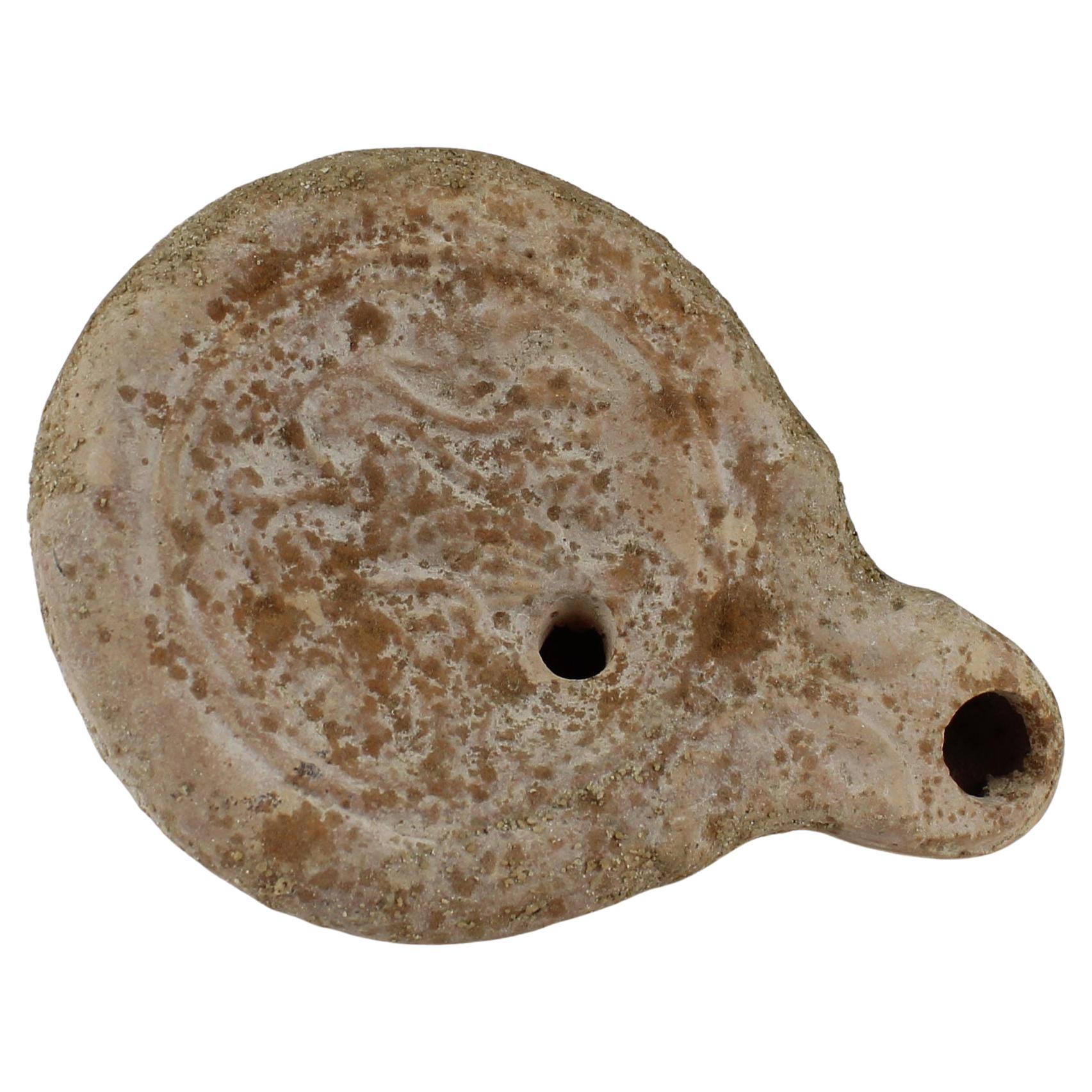 Roman oil lamp with leaves and fruit For Sale