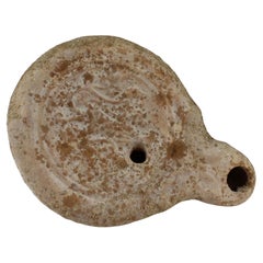 Antique Roman oil lamp with leaves and fruit