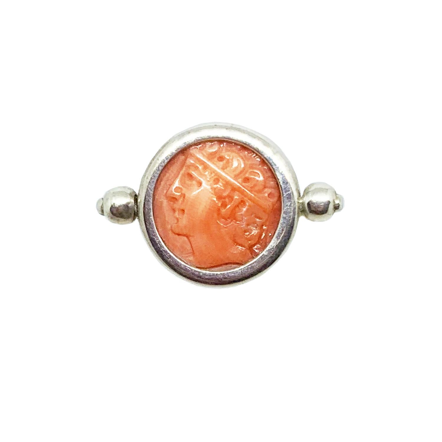 An authentic roman cameo (3-4th century AD ),  depicting the head of Demeter , is set in this sterling silver ring. Demeter , Ceres for Romans, was a maternal divinity of earth and fertility, tutelary deity of the crops, and goddess of birth.
Coral
