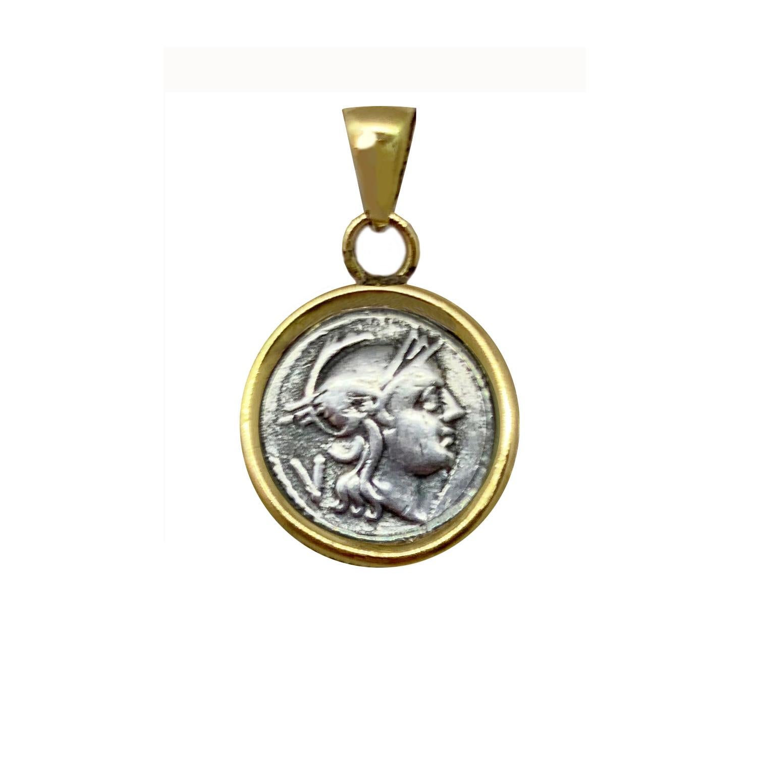 In the center of this 18 Kr Gold pendant , there is  an authentic Roman coin (silver denarius- 3dt century B.C. ) depicting the head of the Goddess Rome .In the reverse side of the coin we can see the Dioscury riding.

In ancient Roman religion,