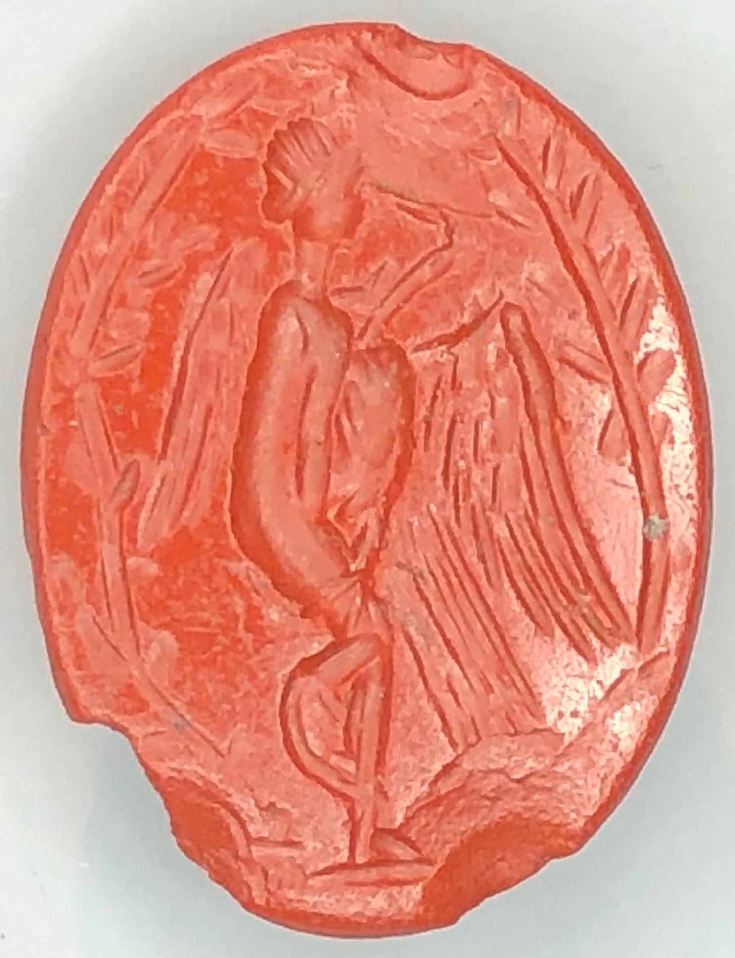 Outstanding dark red jasper intaglio depicting Leda and the swan. Roman, first century AD. The story of Leda and the swan is a popular theme in ancient art. According to Greek mythology, Zeus disguised as a swan seduces Leda, who was the wife of