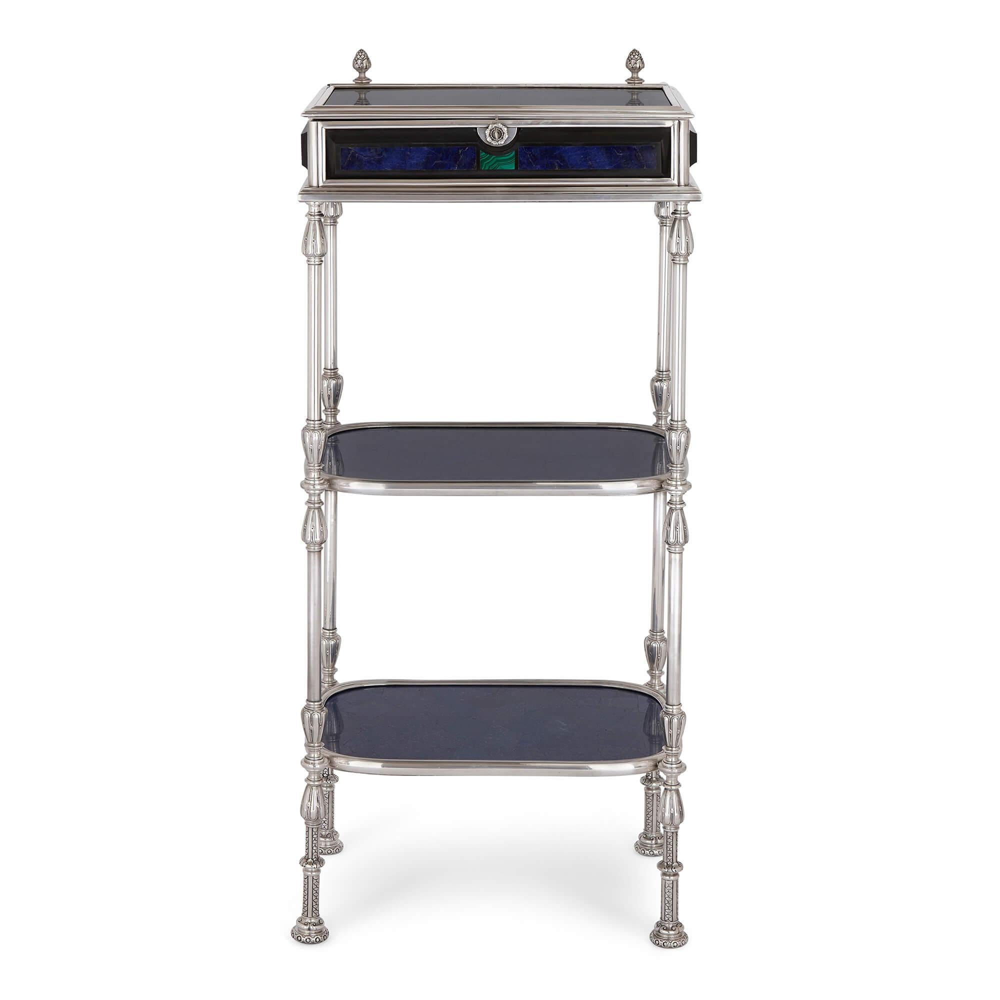 Lapis lazuli, malachite and silvered bronze étagère jewellery case table
Italian, 19th Century 
Height 95cm, width 41cm, depth 29cm

The finest materials have been used to craft this superb antique étagère case table. Of a rectangular frame, the